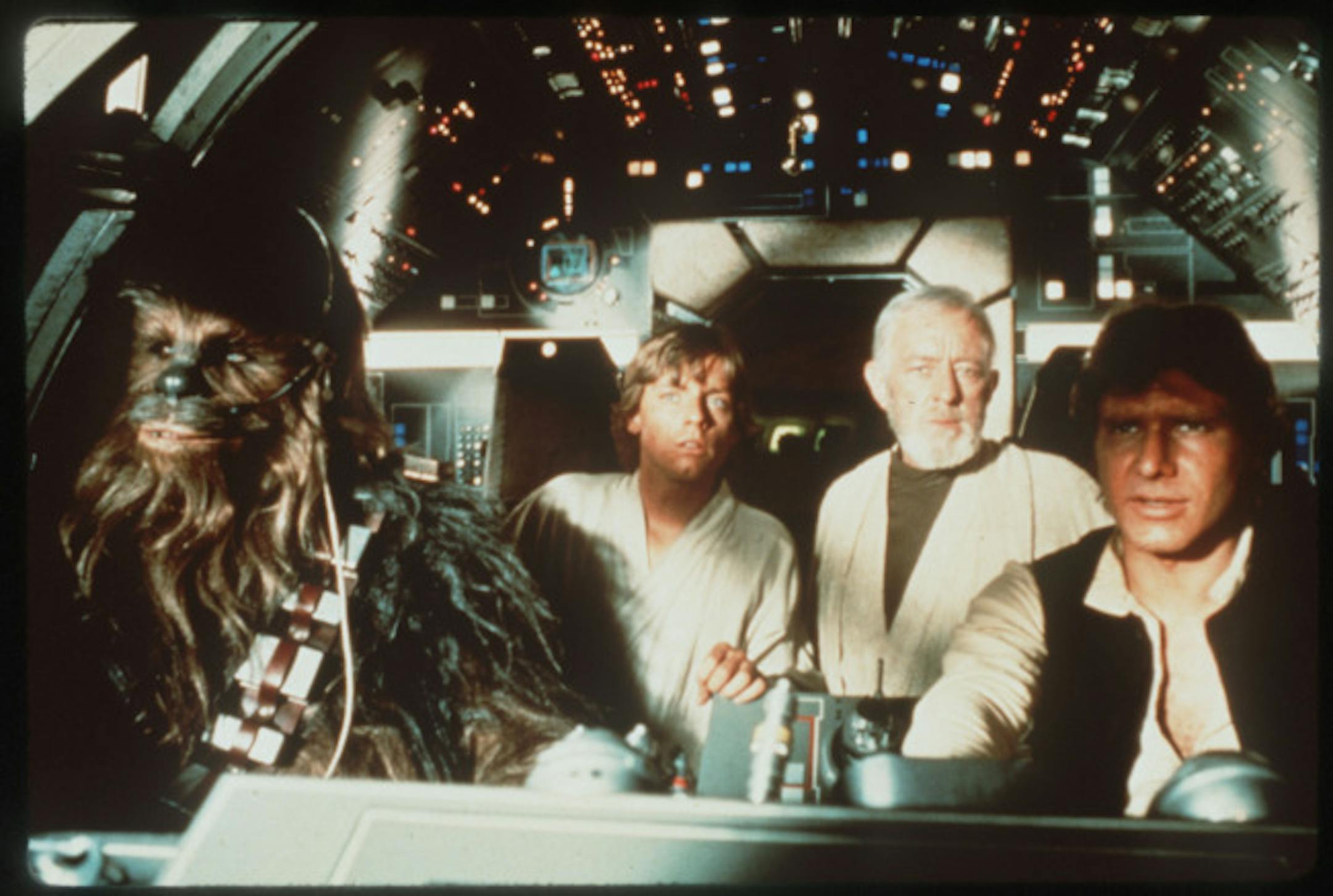 Peter Mayhew (as Chewbacca), Mark Hamill, Alec Guiness, and Harrison Ford in "Star Wars."