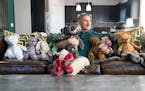 Christopher Straub poses for a portrait with some of his "Inside-Out Critters" Tuesday, September 20, 2022 at his home in Shakopee, Minn. ]