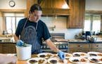 Chef Sean Sherman, who is Oglala Lakota and draws from the knowledge of the Lakota and Ojibwe tribes for his cooking, plating in the kitchen at Coteau