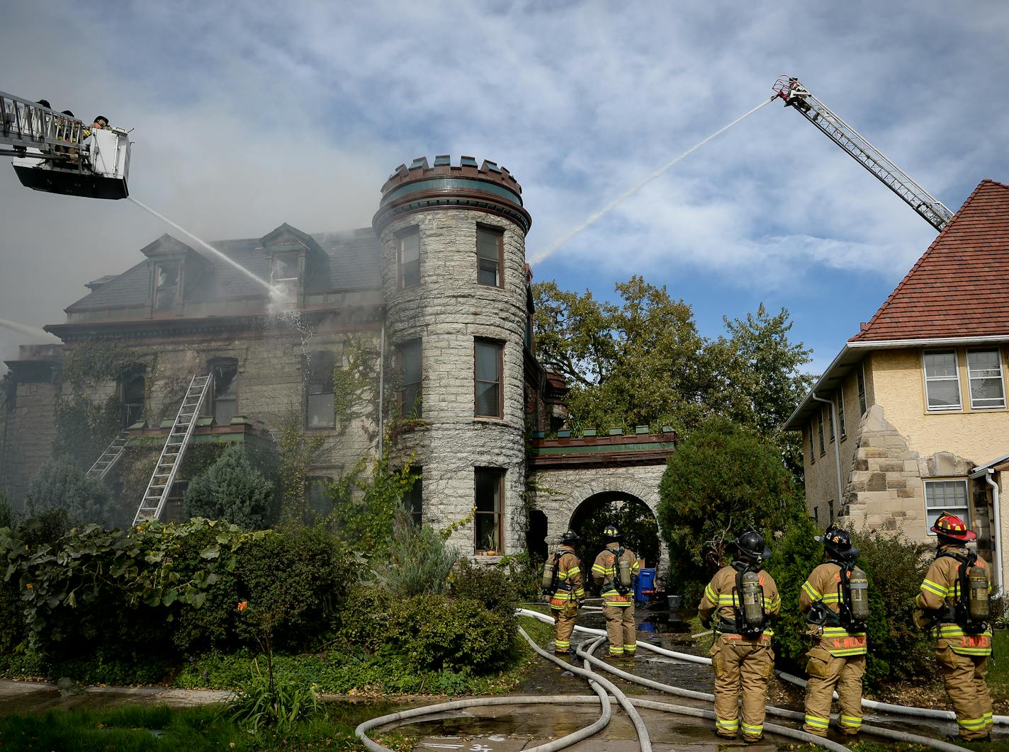 Firefighters battled a fire at a fully engulfed historic home on Dayton Avenue in St. Paul Tuesday. ] AARON LAVINSKY &#xef; aaron.lavinsky@startribune.com St. Paul firefighters battled a fire at a fully engulfed historic home on Dayton Avenue near the St. Paul Cathedral on Tuesday, Oct. 10, 2017.