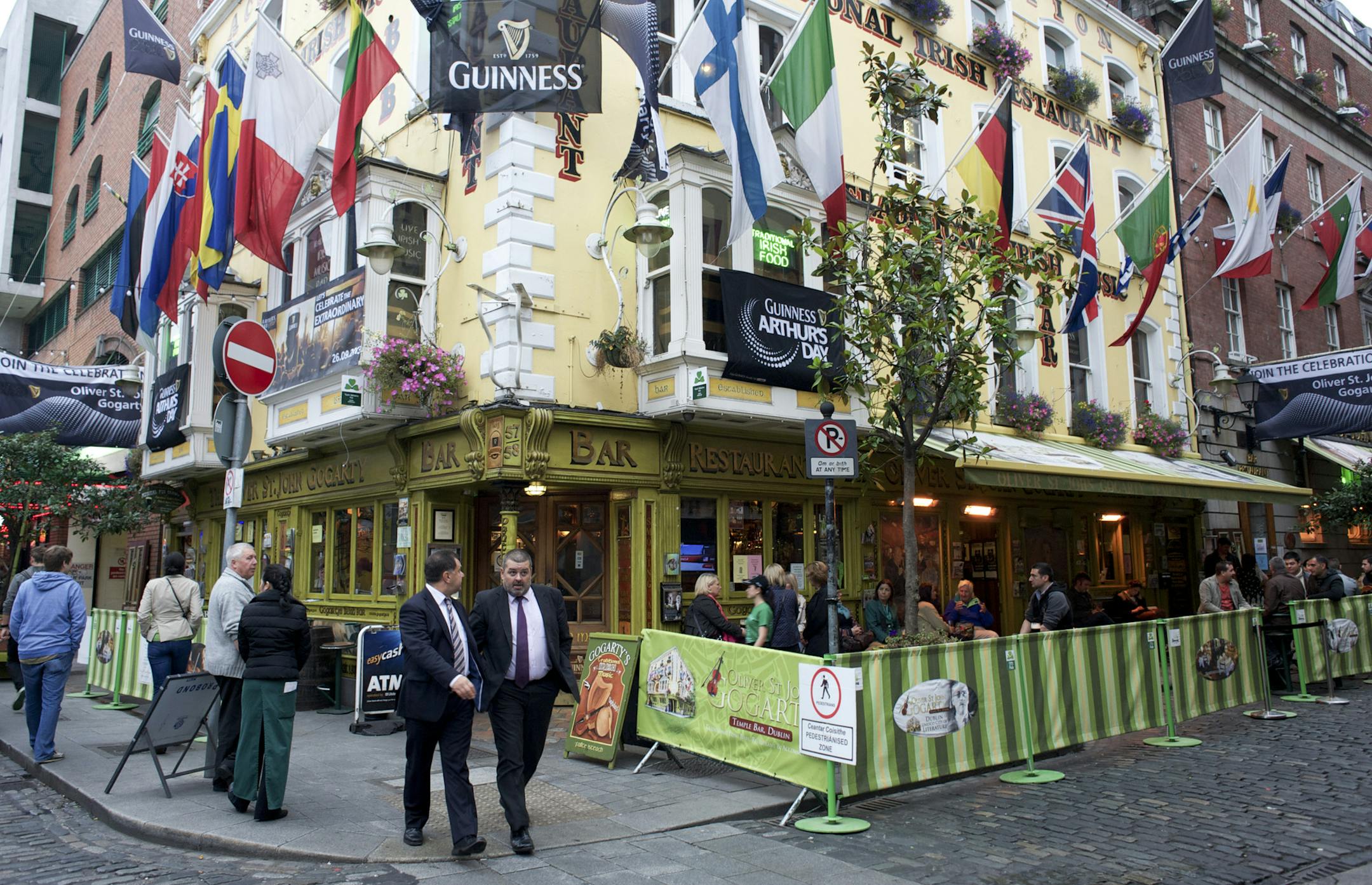 Patrons at a pub in Dublin, Sept. 25, 2013. Arthur’s Day, an annual paean to Guinness first concocted by marketing gurus in 2009 to promote the 250th anniversary of the drink, has recently come under fire by an unlikely alliance of critics blasting the event on health, cultural and artistic grounds. (Paulo Nunes dos Santos/The New York Times)