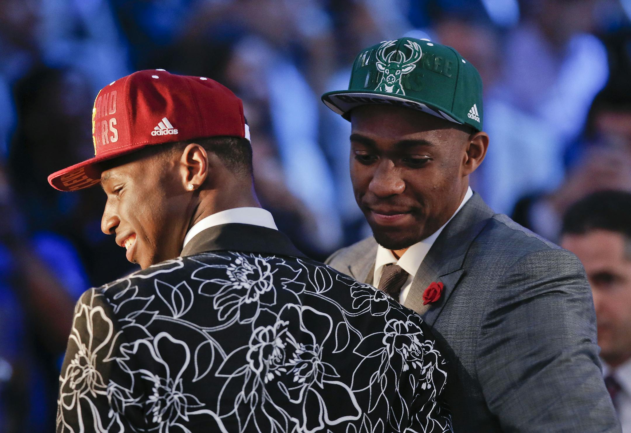 Andrew Wiggins, left, and Jabari Parker stop for television interviews after being selected as the top two picks in the 2014 NBA draft, Thursday, June 26, 2014, in New York. Wiggins was selected number one by the Cleveland Cavaliers and Parker was chosen number two by the Milwaukee Bucks. (AP Photo/Kathy Willens) ORG XMIT: NYJJ113