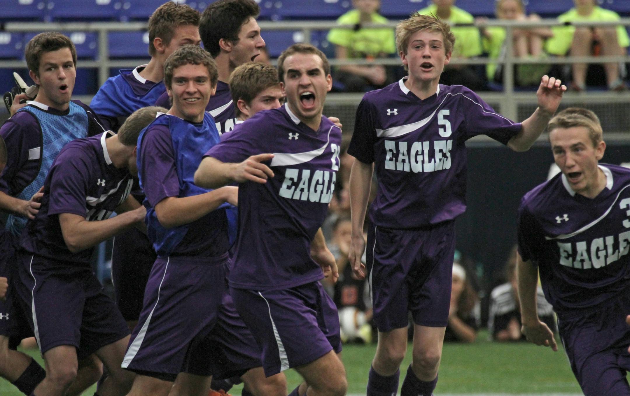 State Boys Soccer Tournament, Class A Championship game, St. Paul Academy and Summit School vs Rochester Lourdes, 11/1/12, Metrodome. (left to right) Rochester Lourdes celebrated their shoot-out win over St. Paul Academy to win the Class A Championship.