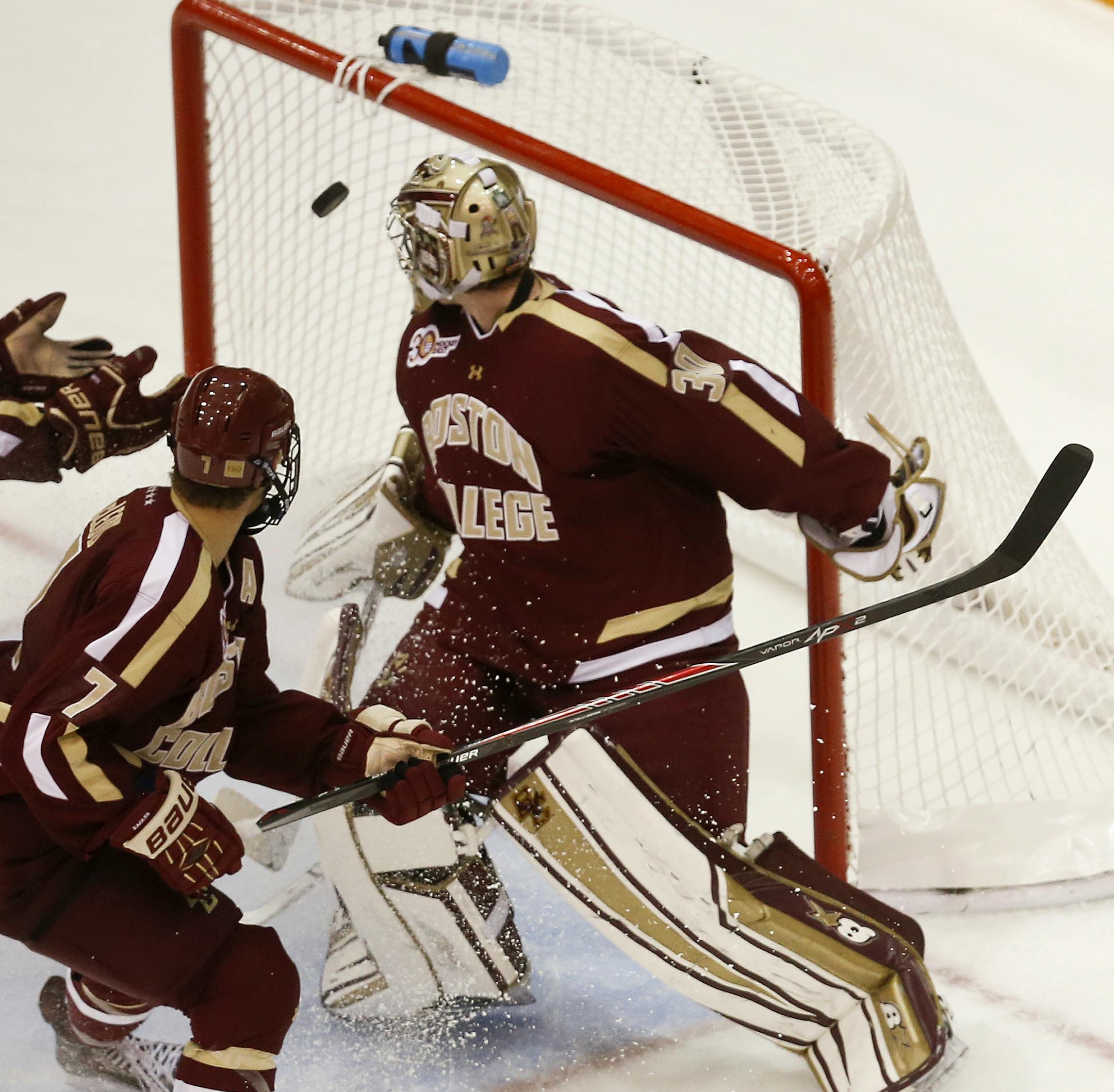 During overtime, Boston College's Ian McCoshen gloved the puck with seconds remaining as BC goalie Thatcher Deko looked on. The play was reviewed and ruled not a goal. Boston College bested the University of Minnesota during a shootout after the game was tied 3-3 after overtime Friday, Oct. 25, 2013, at Mariucci Arena in Minneapolis, MN.](DAVID JOLES/STARTRIBUNE) djoles@startribune.com University of Minnesota versus Boston College in men's hockey at Mariucci Arena Friday, Oct. 25, 2013, in Minne