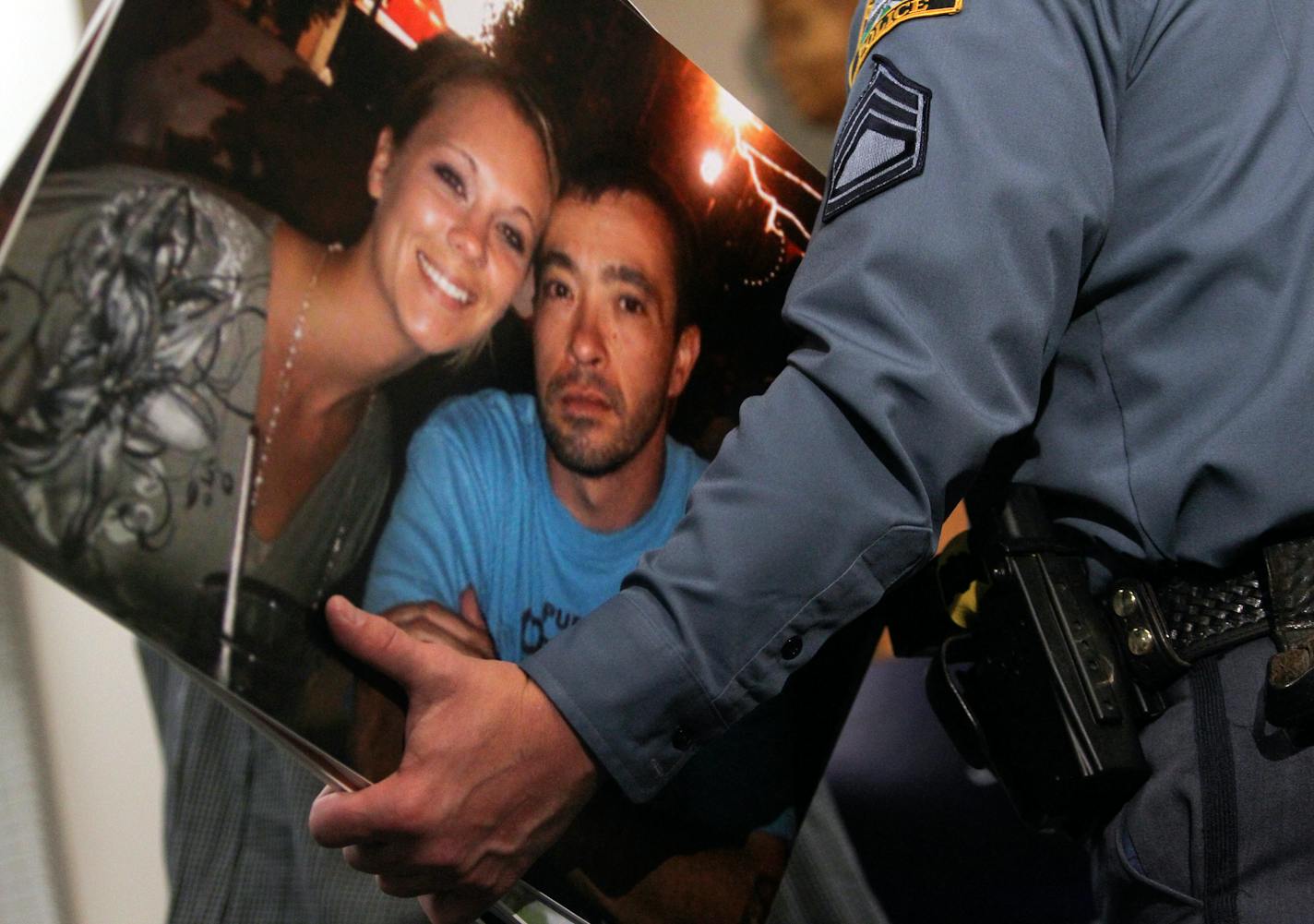 St. Paul Police Sgt. Paul Paulos told the media on March 1, 2013, in St. Paul that a special tip line has been set up regarding the disappearance and presumed murder of Kira Trevino. Her husband, Jeffery Trevino, 39, was has been charged with her death. Paulos holds a photo of the couple.