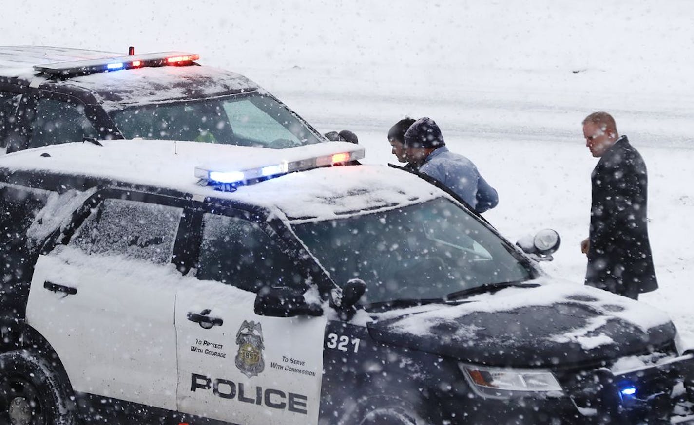 A person of interest was taken into custody after a school bus driver was shot where Interstate 35W and 94 run together near downtown Minneapolis.