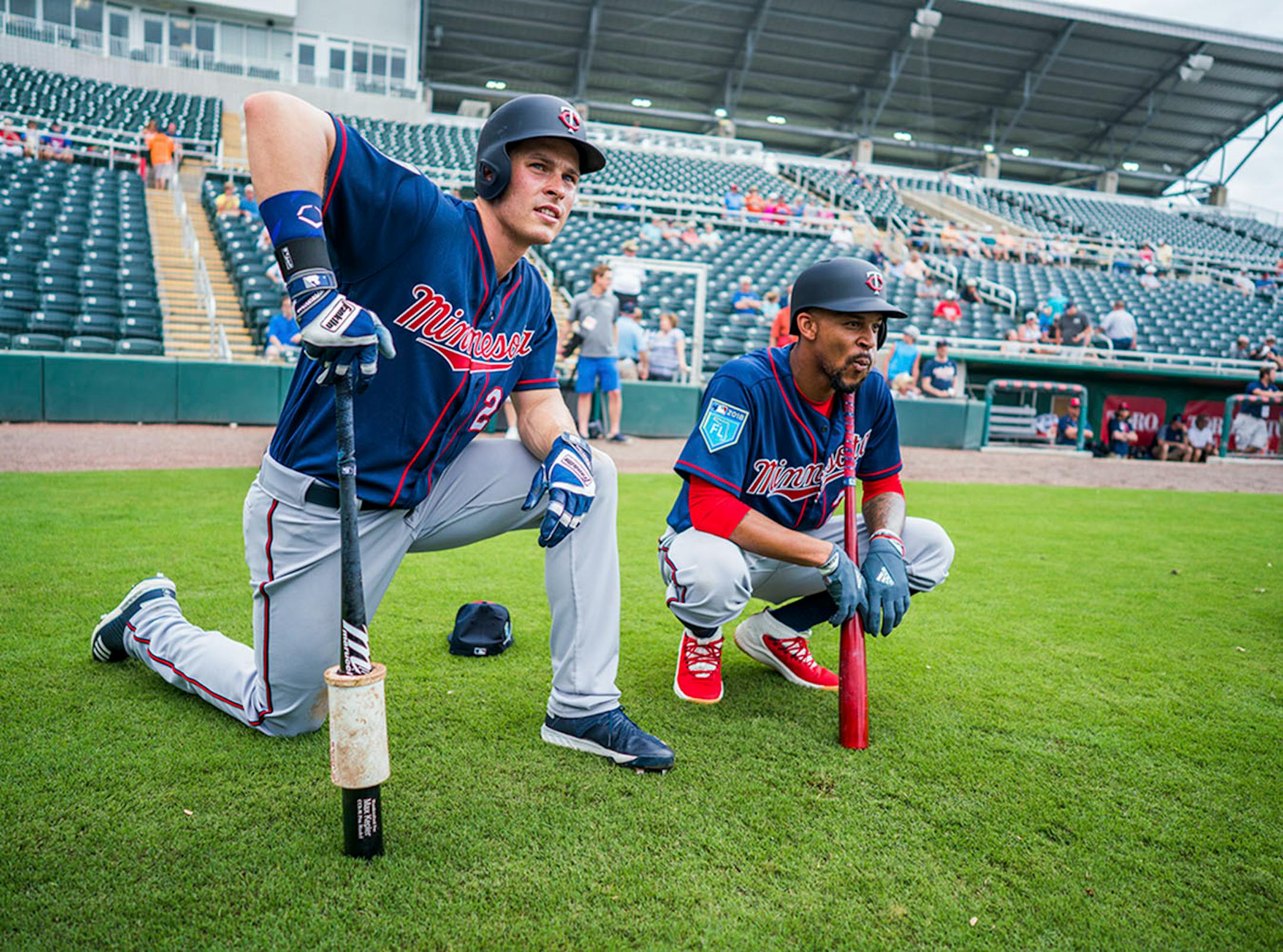 Twins outfielder Max Kepler (26) and Twins outfielder Byron Buxton (25) watched batting practice.