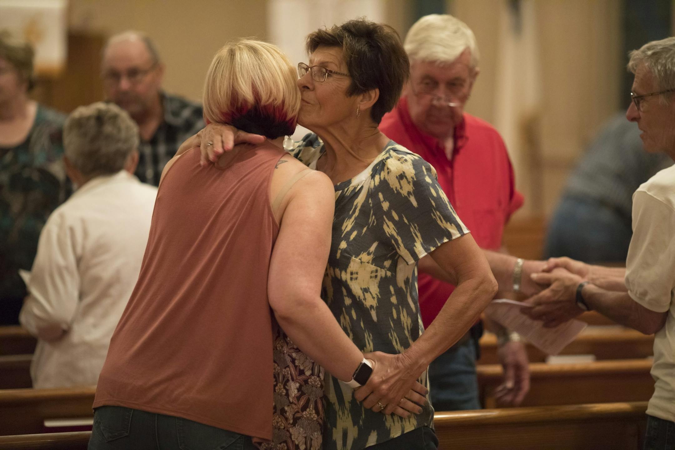 Arleen Stahnke hugged her daughter-in-law Malissa (cq) Parrott-Stahnke during the "peace be with you" moment of the service at Vasa Lutheran Church in Vasa, Minn., on Sunday, June 11, 2017.