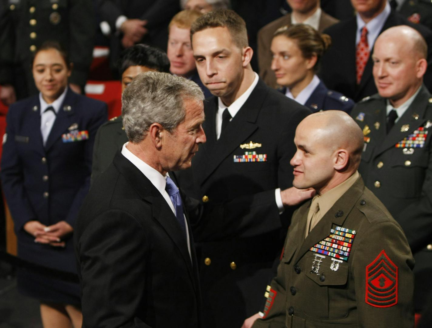 President Bush shakes hands with members of the military after delivering remarks on the "Global War on Terror" Wednesday, March 19, 2008, at the Pentagon in Washington. (AP Photo/Gerald Herbert) ORG XMIT: WHGH105