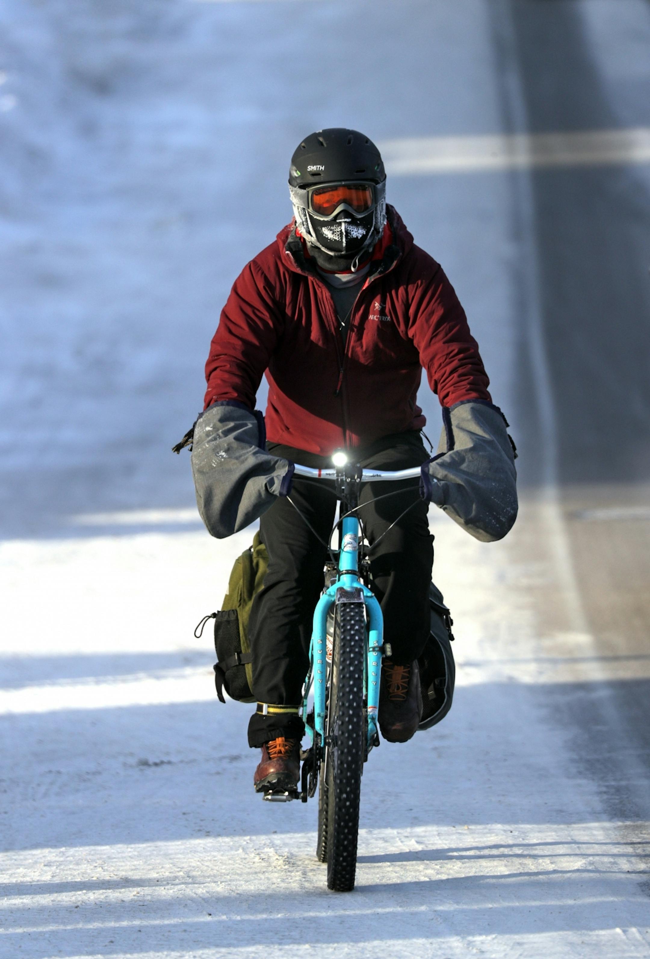 With temperatures dipping into the upper 20's below zero with a -50 wind chill, this St. Paul bike commuter wasn't deterred . West 7th neighborhood was steaming Wednesday morning as furnaces tried to keep up with the record breaking cold.