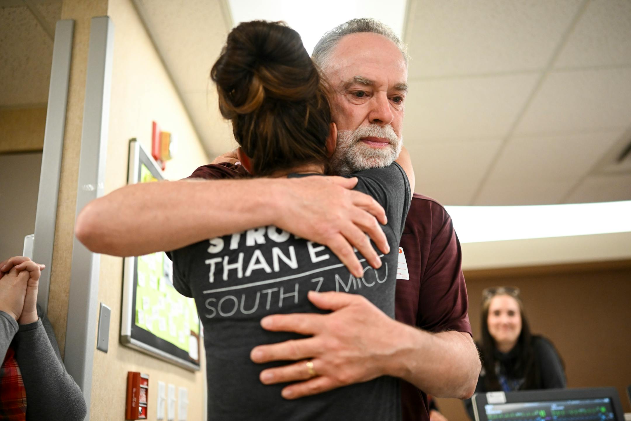 COVID survivor Rick Ulrich, of Norwood Young America, embraces critical care nurse Holly Vilione Thursday, May 11, 2023, at North Memorial Health Hospital's South Seven Intensive Care Unit in Robbinsdale, Minn. Ulrich returned to North Memorial with his wife Deb and two daughters to bring lunch and thank the healthcare workers he credits for saving his life during his nearly month-long stay in the ICU in late 2020.