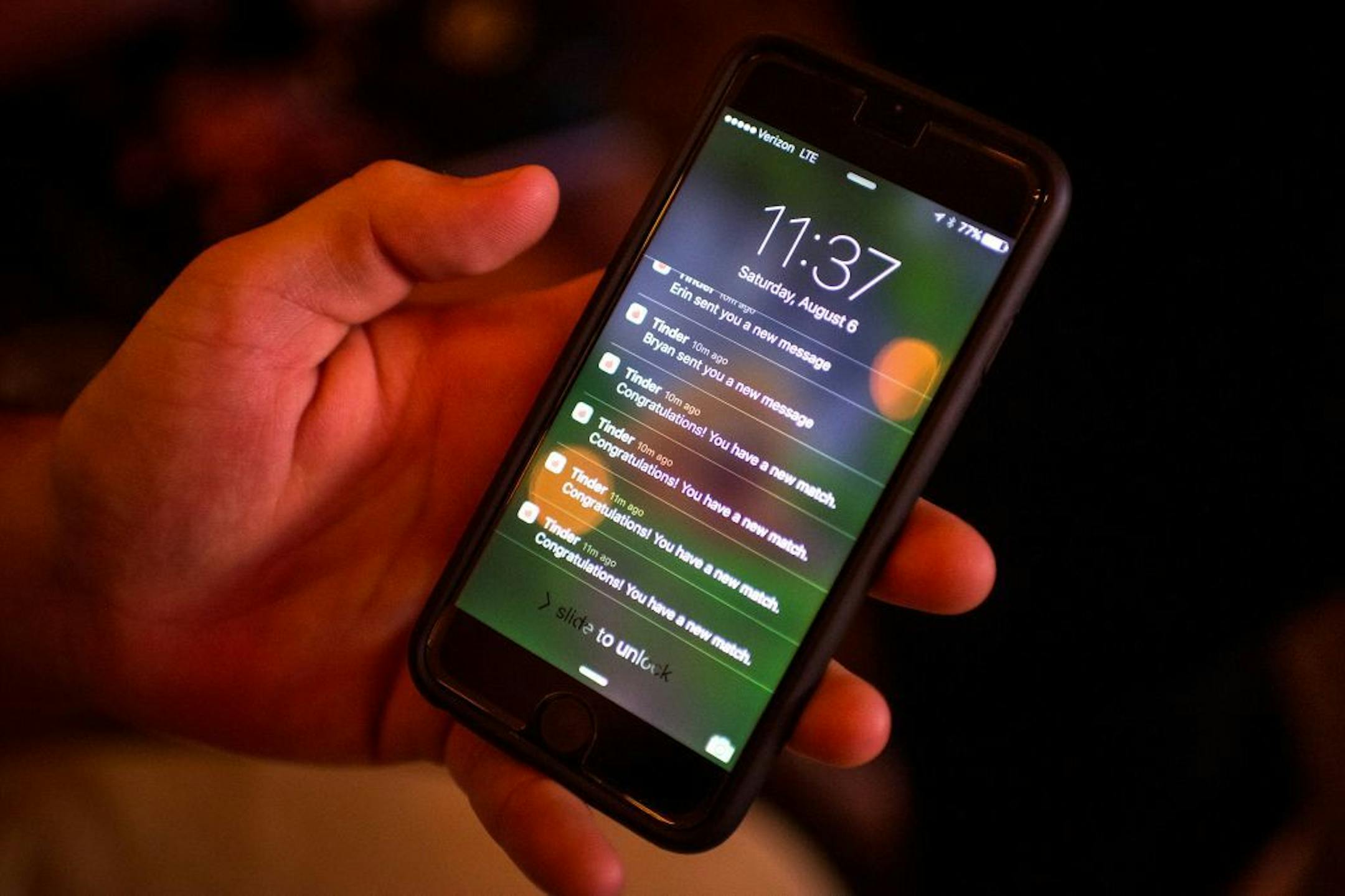 Michael Durand, of Rockford, Minn., checked his Tinder notifications late Saturday night at Cowboy Jack's in downtown Minneapolis.   ] (AARON LAVINSKY/STAR TRIBUNE) aaron.lavinsky@startribune.com  Tinder has launched a feature that lets groups of friends match with other groups, an interesting navigation around "Minnesota Nice." Star Tribune features reporter Danielle Fox writes a first-person, experiential story with roommate and reporter Natalie Daher as the two go out with three groups found on Tinder Social on Saturday, August 6, 2016 in downtown Minneapolis.