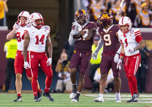 Gophers safety Tyler Nubin (27) celebrated after intercepting Nebraska quarterback Jeff Sims in the second quarter, one of his two pickoffs in Thursda