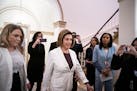House Speaker Nancy Pelosi, D-Calif., arrives in the Capitol, as her daughter, the documentarian Alexandra Pelosi, films from behind, in Washington on