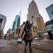 The Mary Tyler Moore statue stands at the corner of Nicollet Mall and 7th St, on the left is City Center where Marshalls is leaving and on the right i