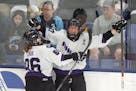 Minnesota forward Taylor Heise, right, celebrates with forward Michela Cava, left, after scoring during Game 1 of the PWHL hockey championship series 