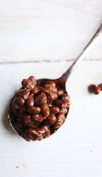 Down-East Baked Beans are flavored with molasses, dark rum, mustard powder and salt pork.
