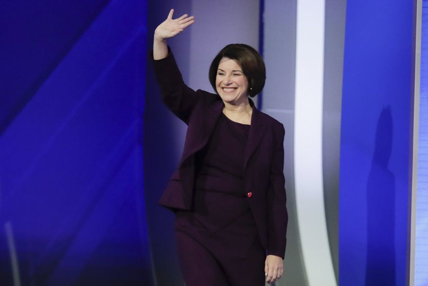 Sen. Amy Klobuchar, D-Minn., waves on stage Friday, Feb. 7, 2020, before the start of a Democratic presidential primary debate hosted by ABC News, Apple News, and WMUR-TV at Saint Anselm College in Manchester, N.H.