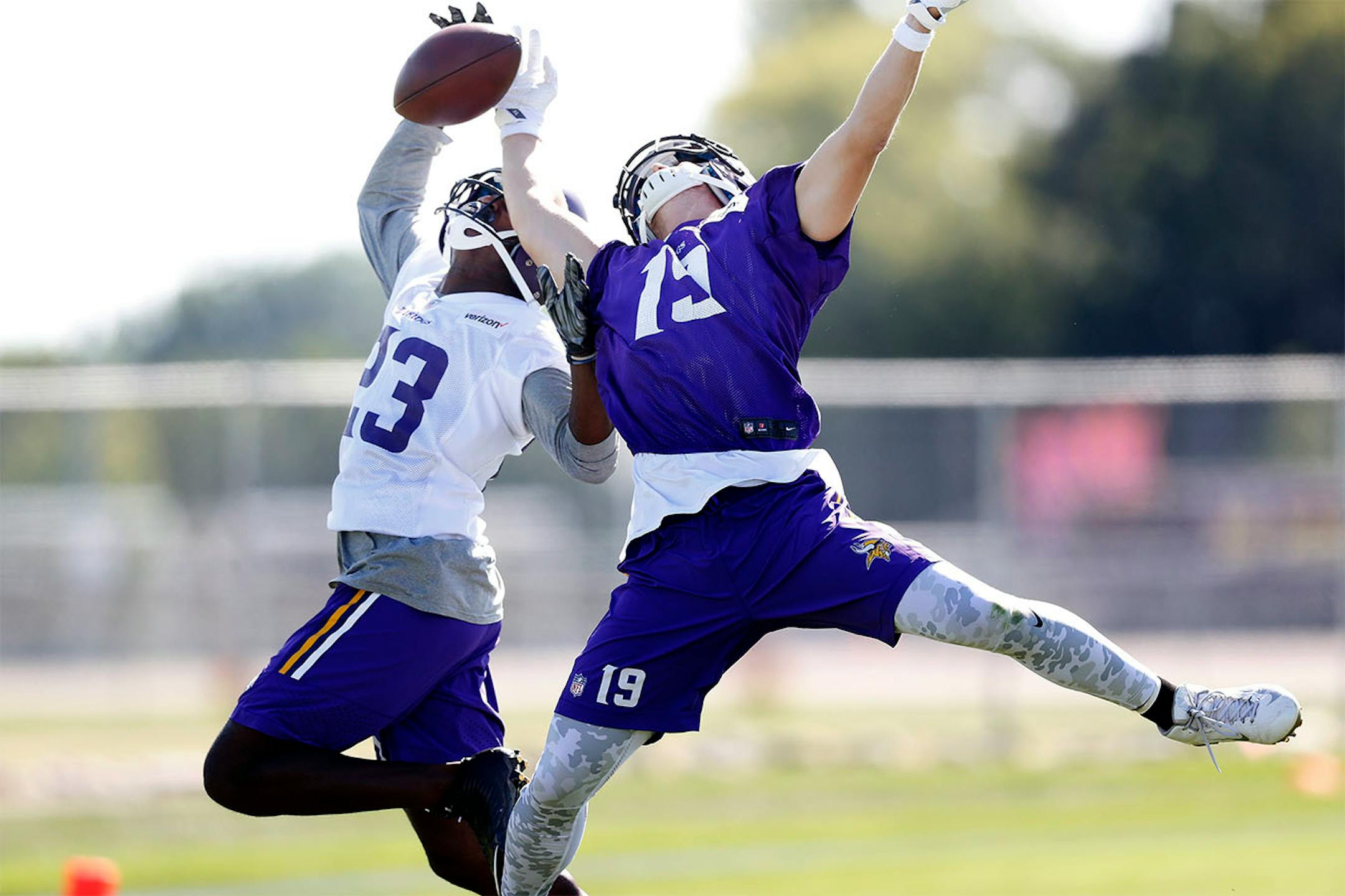 Terence Newman (23) broke up a pass intended for Adam Thielen (19) during the afternoon practice on the first day of training camp in Mankato.