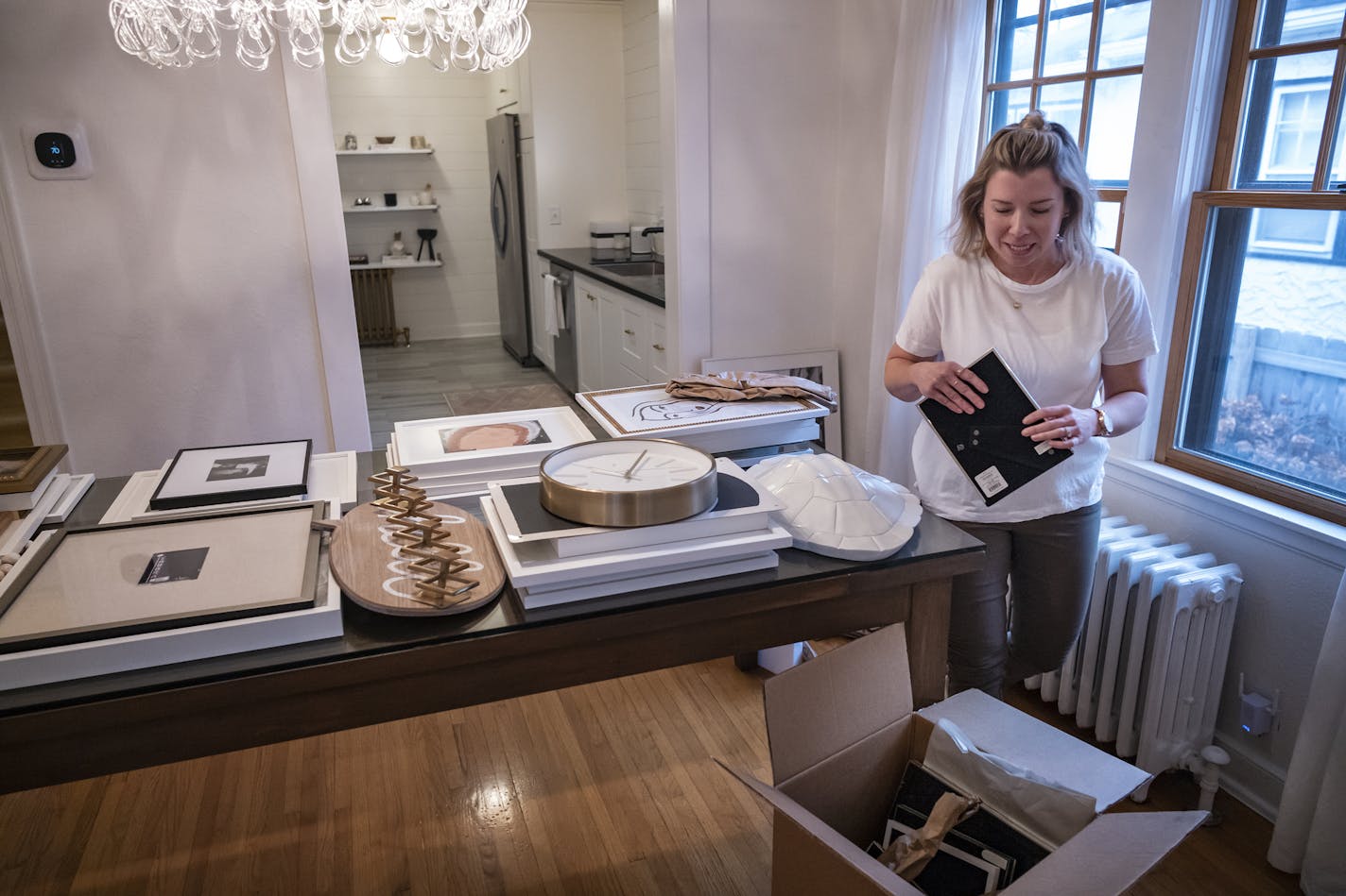 Brooke Bundy, an interior designer is packing for their move to Dallas, Texas where her husband has been transferred. They listed their house for $399,900. Within a day they had multiple offers. Sales closes next week. ] RICHARD TSONG-TAATARII &#xa5; richard.tsong-taatarii@startribune.com