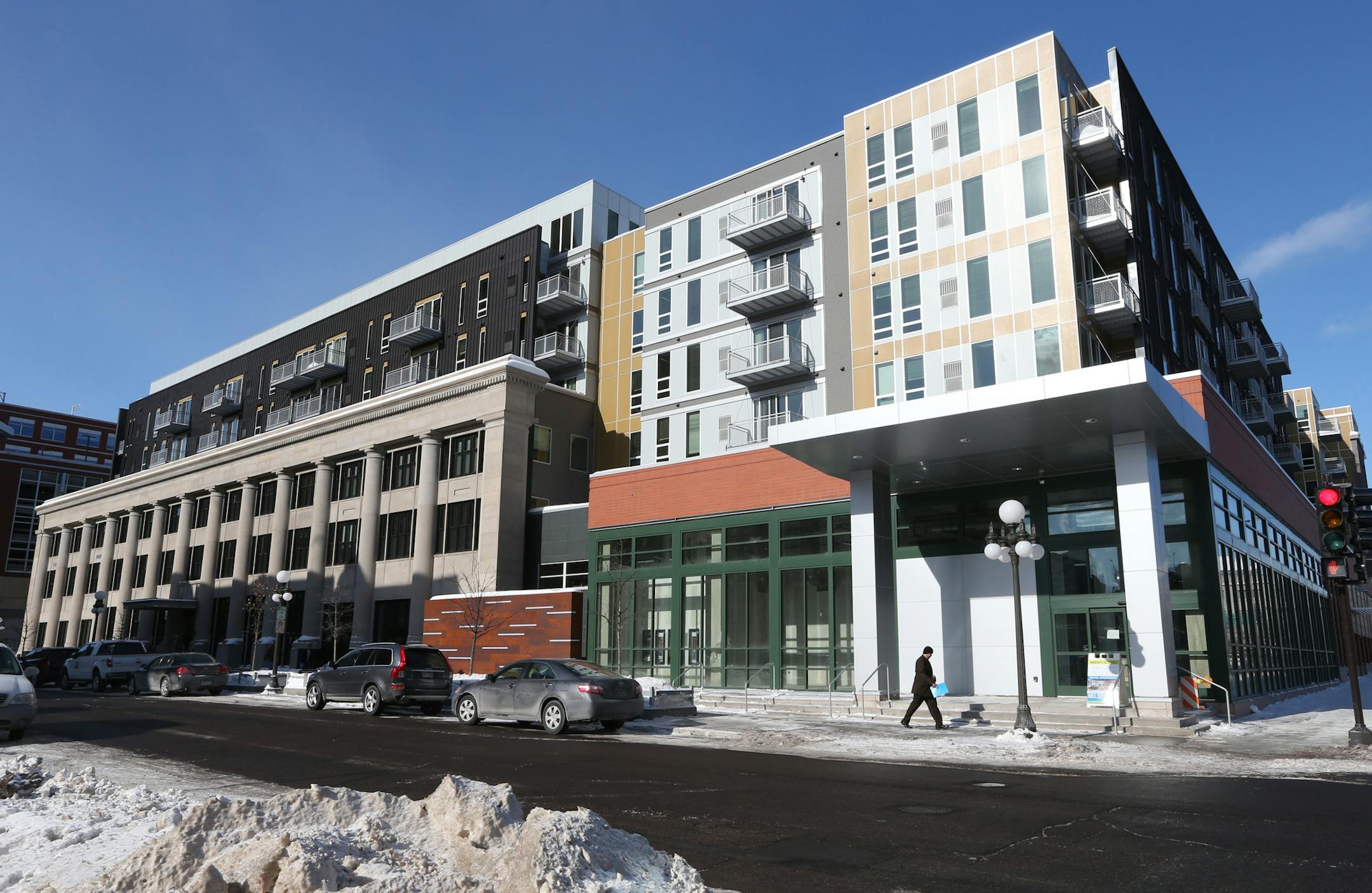 After 10 years of planning, downsizing and finally a takeover by the city -- which served as its developer -- the Penfield, a building of market-rate apartments in downtown St. Paul, marked its grand opening Feb. 6, 2014.