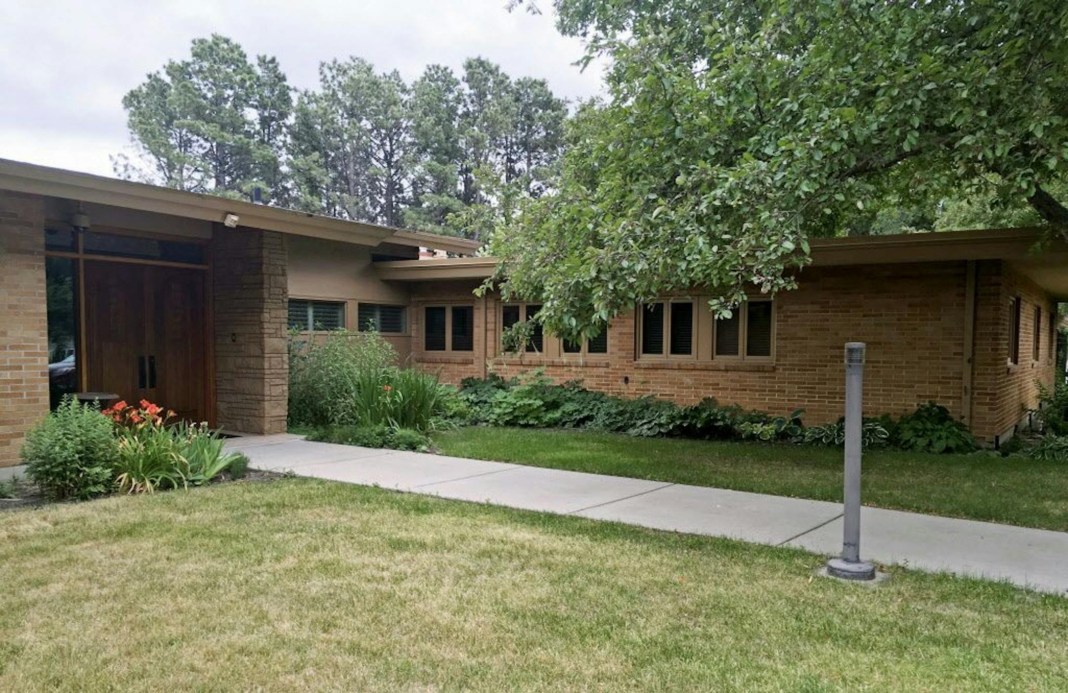 FILE - This July 12, 2017 file photo shows the North Dakota's governor's residence in Bismarck. The mansion will meet the wrecking ball after no one offered to buy the building and move it to a new location. The state wanted to preserve the 10,000-square-foot home that has served North Dakota's first families for 57 years, while making way for a larger $5 million mansion that's under construction.