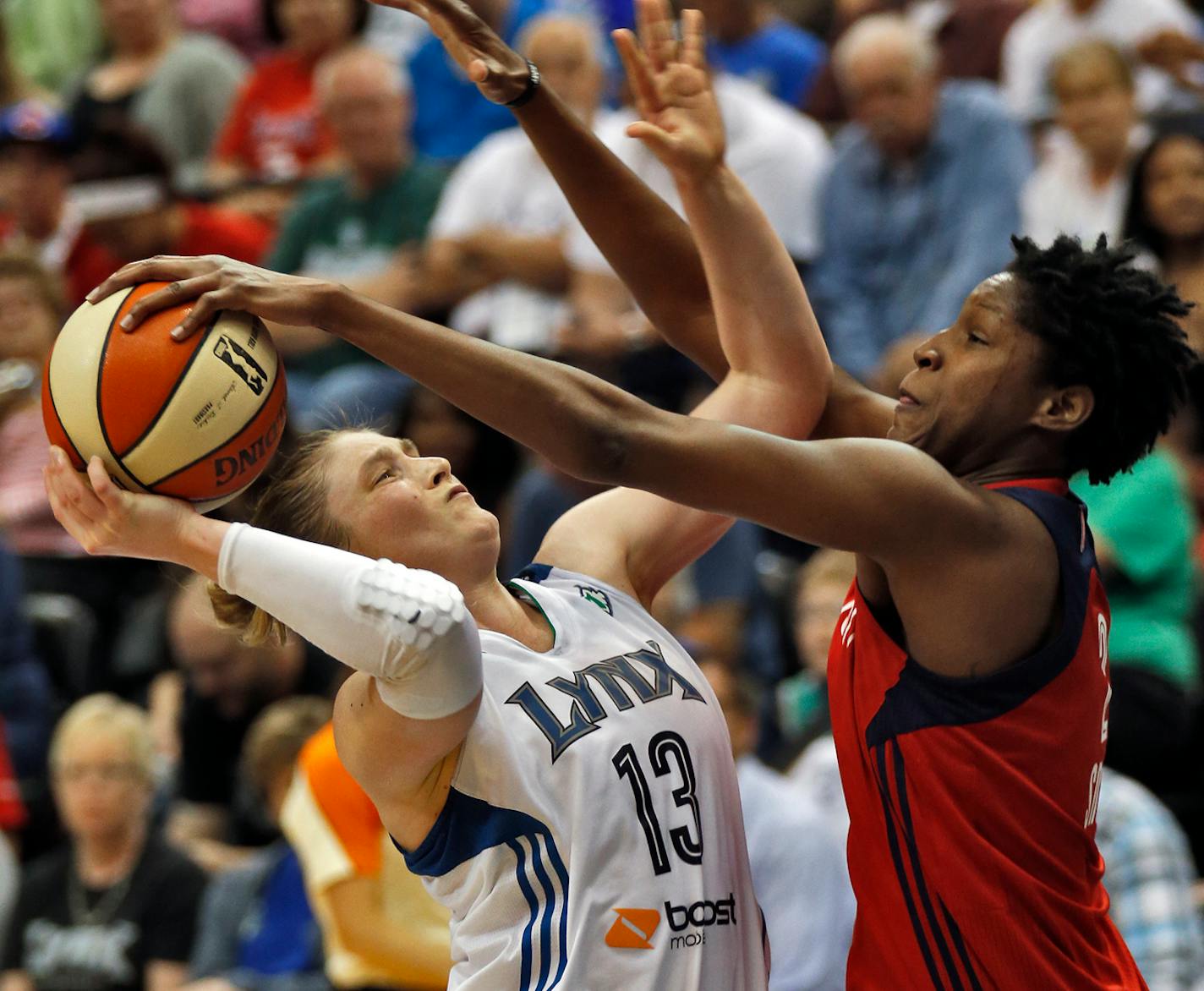 Minnesota Lynx vs. Washington Mystics. Washington won 79-75. Lynx Lindsay Whalen (13) had her layup attempt blocked by Mystics Crystal Langhorne, but Langhorne was called for a foul on the play. (MARLIN LEVISON/STARTRIBUNE(mlevison@startribune.com)