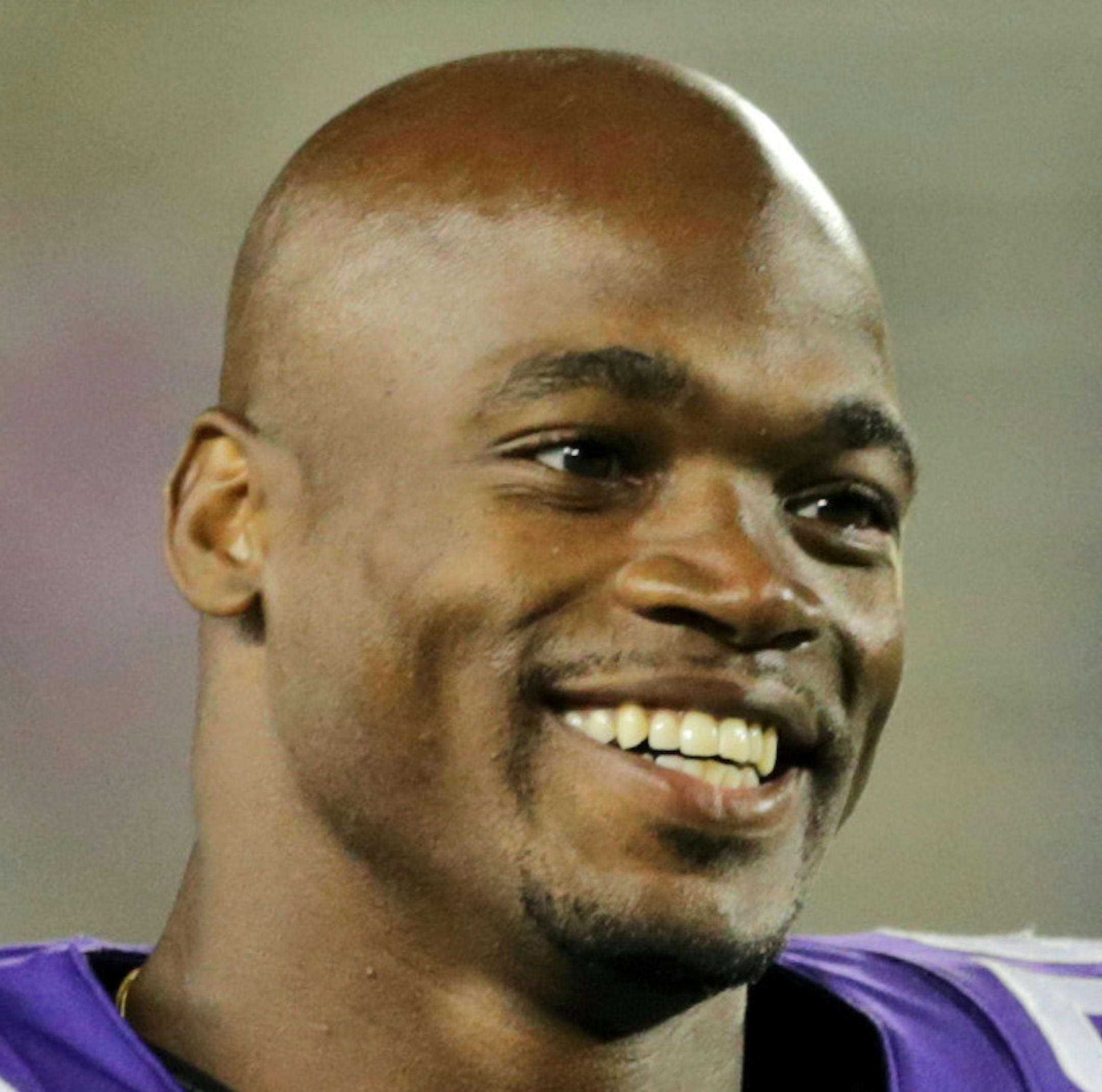 FILE - In this Aug. 8, 2014, file photo, Minnesota Vikings running back Adrian Peterson leaves the field after an NFL preseason football game against the Oakland Raiders in Minneapolis. The NFL has reinstated Minnesota Vikings running back Adrian Peterson, clearing the way for him to return after missing most of last season while facing child abuse charges in Texas. The league announced its decision on Thursday, April 16, 2015. (AP Photo/Jim Mone, File)