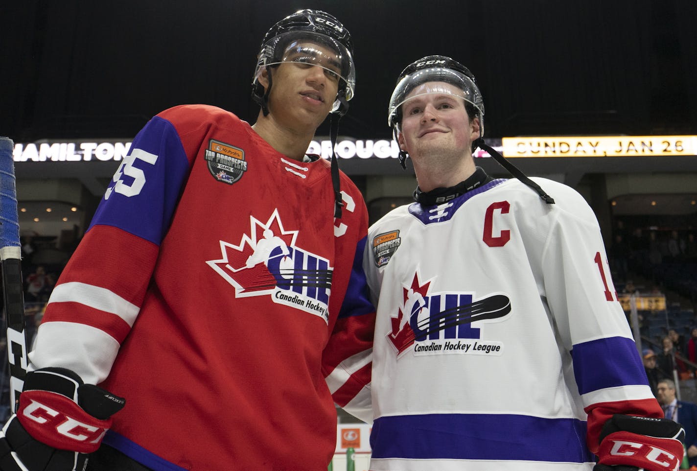 FILE - In this Jan. 16, 2020, file photo, Team Red center Quinton Byfield (55) and Team White left winger Alexis Lafreniere (11) pose for photos following hockey's CHL Top Prospects Game in Hamilton, Ontario. The New York Rangers might be on the clock in owning the No. 1 pick in the NHL draft on Tuesday, Oct. 6. That, and the prospect of selecting Quebec star forward Alexis Lafreniere, doesn't mean the still-retooling Rangers will be anywhere closer to being a contender, team president John Davi