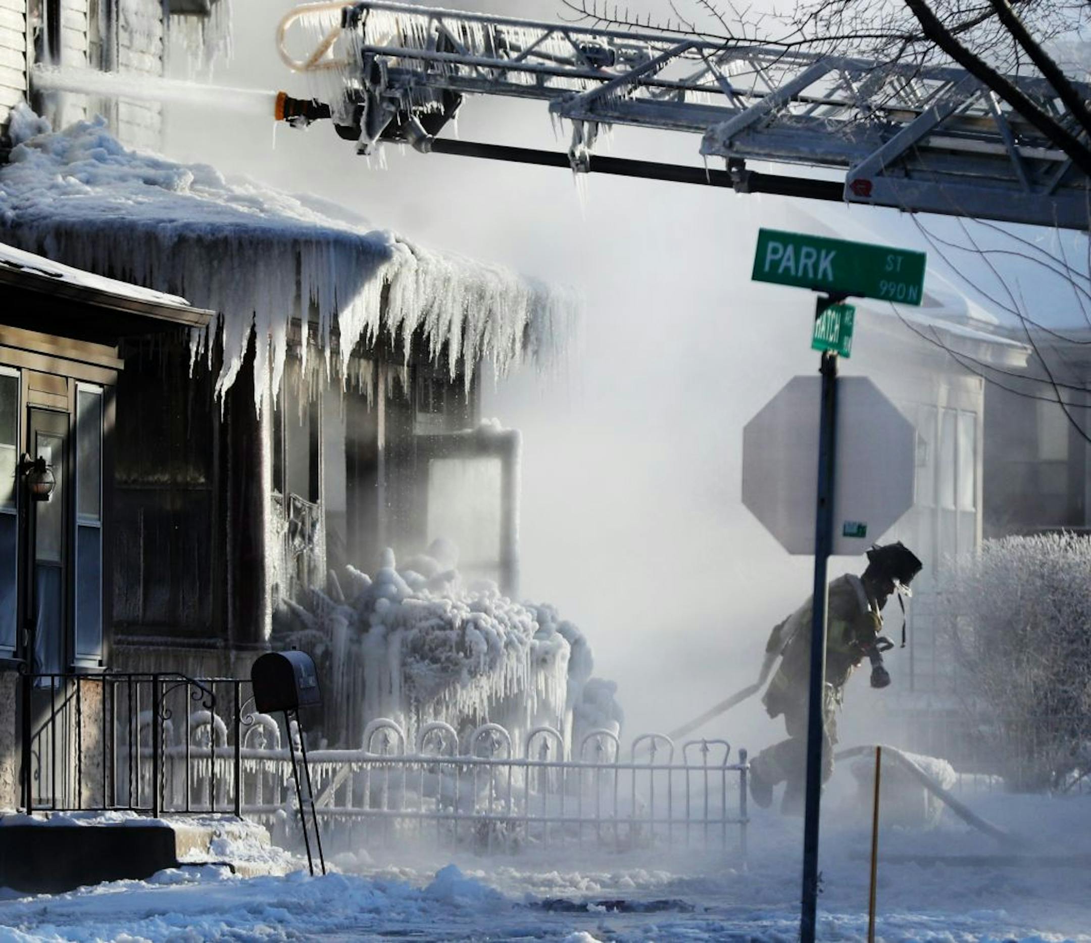 St. Paul firefighters at the scene of a house fire at Hatch Ave. and Park St. Wednesday, Jan. 30, 2019, In St. Paul, MN.