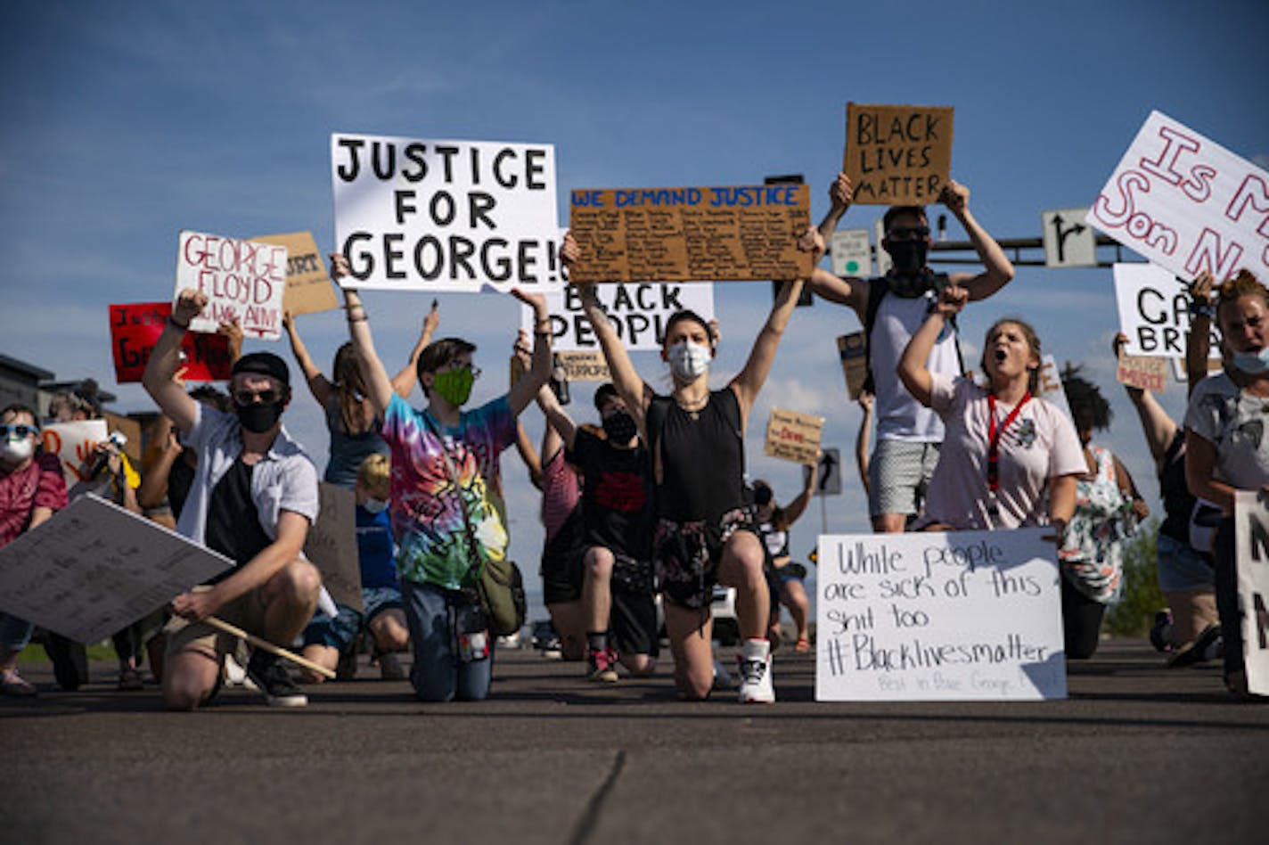 After an hour and a half of protesting on street corners, demonstrators moved into the street to block the intersection of London Rd and 21st Ave E in Duluth, MN. ] ALEX KORMANN • alex.kormann@startribune.com Over 100 people showed up on the corner of London Rd and 21st Ave E in Duluth, MN on Wednesday May 27, 2020 to protest the death of George Floyd. Protestors started by chanting on the corners and eventually shut down the intersection and marched down London Rd.