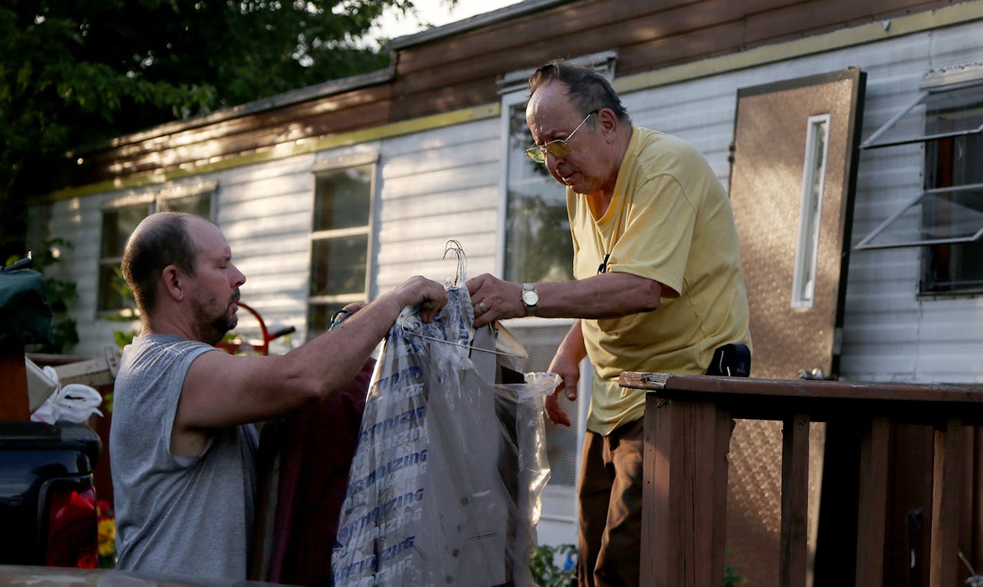 Jerry Wonsewicz, 80, right, gets help moving his belongings from his one Gary Wonsewicz, 57, both residents of Lowry Grove mobile home park Friday, June 30, 2017, in St. Anthony, MN. Lowry Grove closed it's gate and all residents had to be gone by 12 midnight on July 1, the space slated to be redeveloped into multiple-family housing.] DAVID JOLES &#x2022; david.joles@startribune.com It&#x2019;s the tale of two parks, with Lowry Grove in St. Anthony and Park Plaza in Fridley providing a case stud