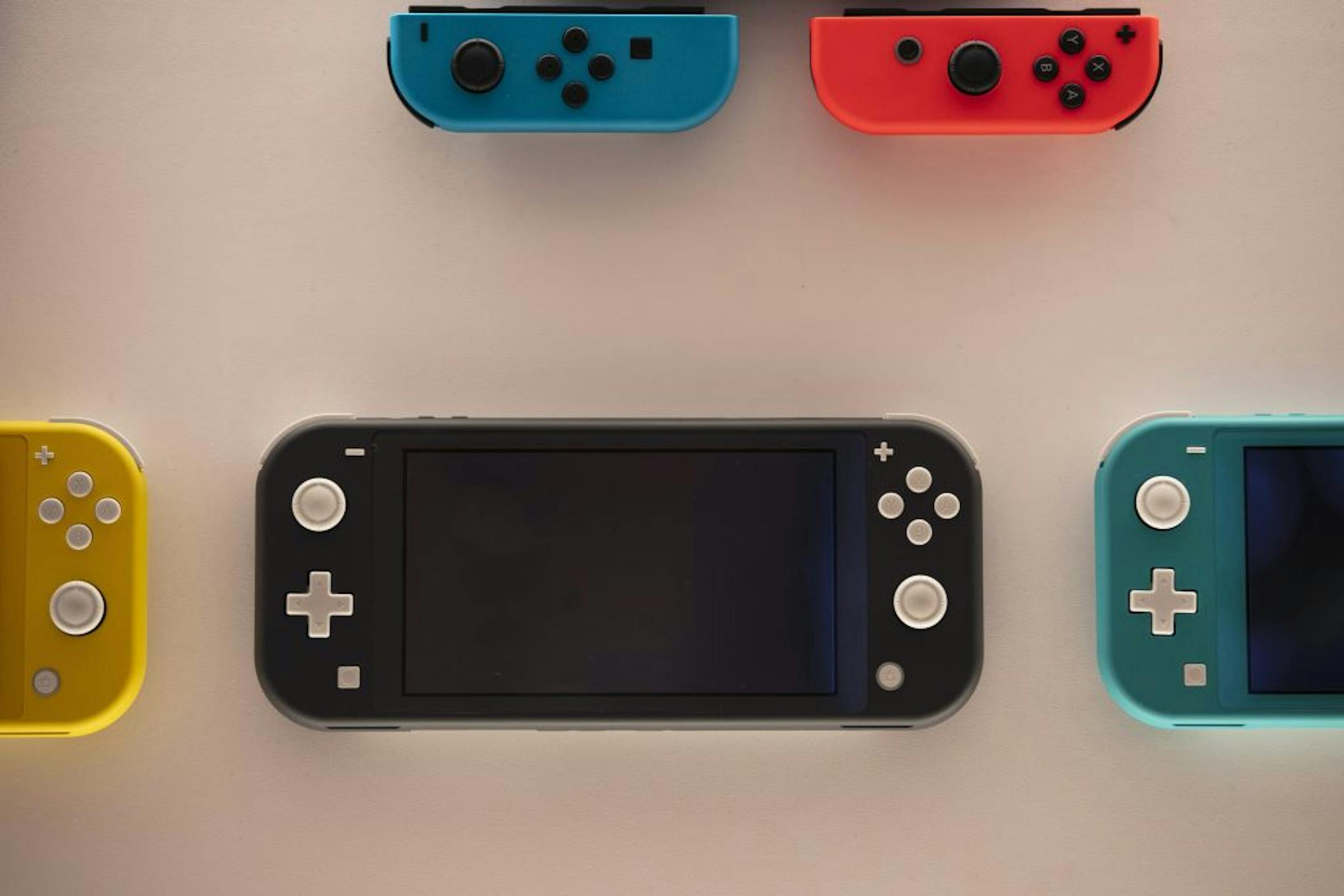 In this Thursday, Jan, 23, 2020, photo, Nintendo Switch game consoles are on display at Nintendo's official store in the Shibuya district of Tokyo. Time spent playing video games can be good for mental health, according to a new study by researchers at Oxford University. The finding comes as video game sales this year have boomed as more people are stuck at home because of the pandemic and many countries have once again imposed limits on public life. The paper released Monday, NOv. 16, 2020 is b