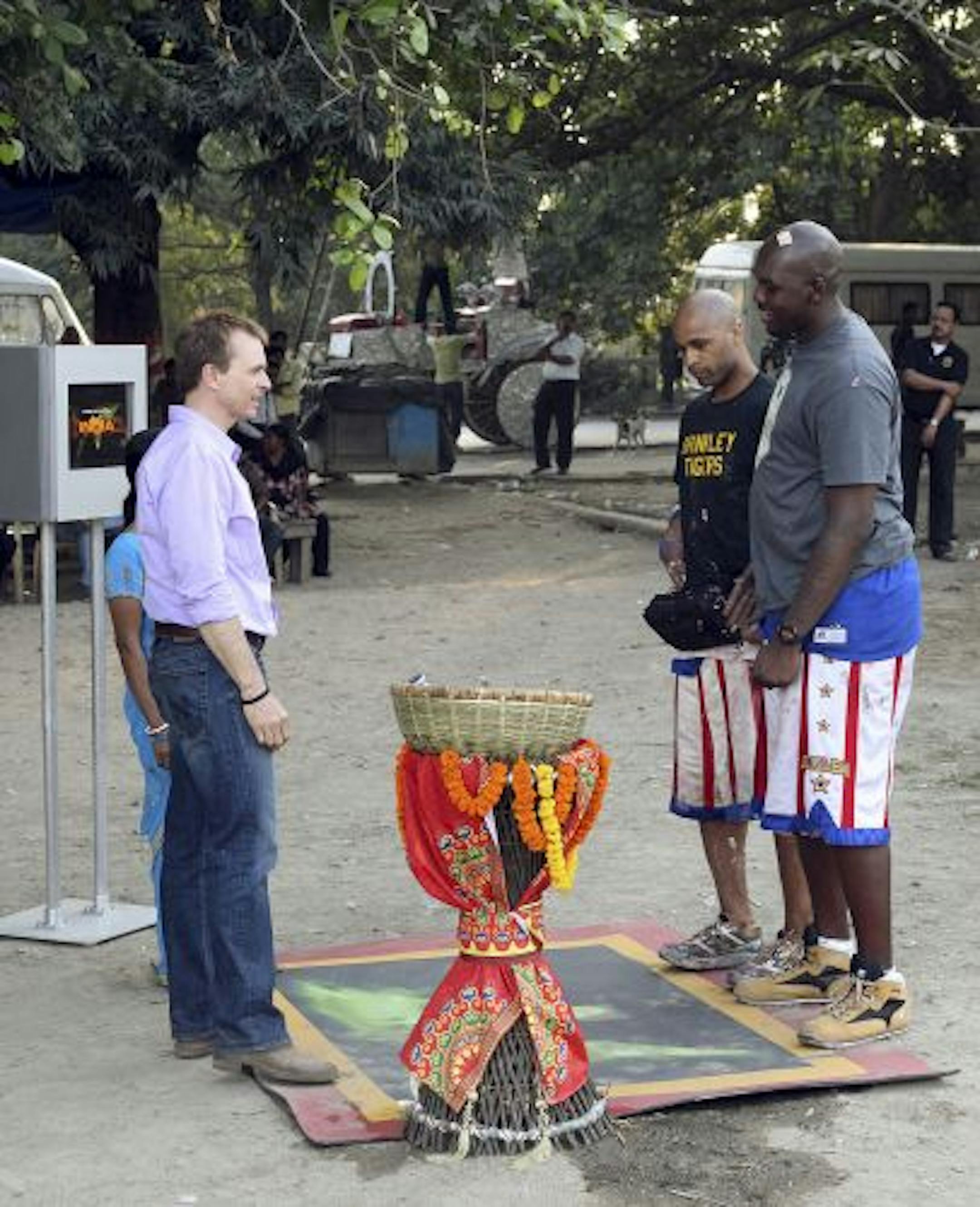 In a recent episode of "The Amazing Race," Globetrotters Flight Time and Big Easy, right, met host Phil Keoghan during a stop in India.