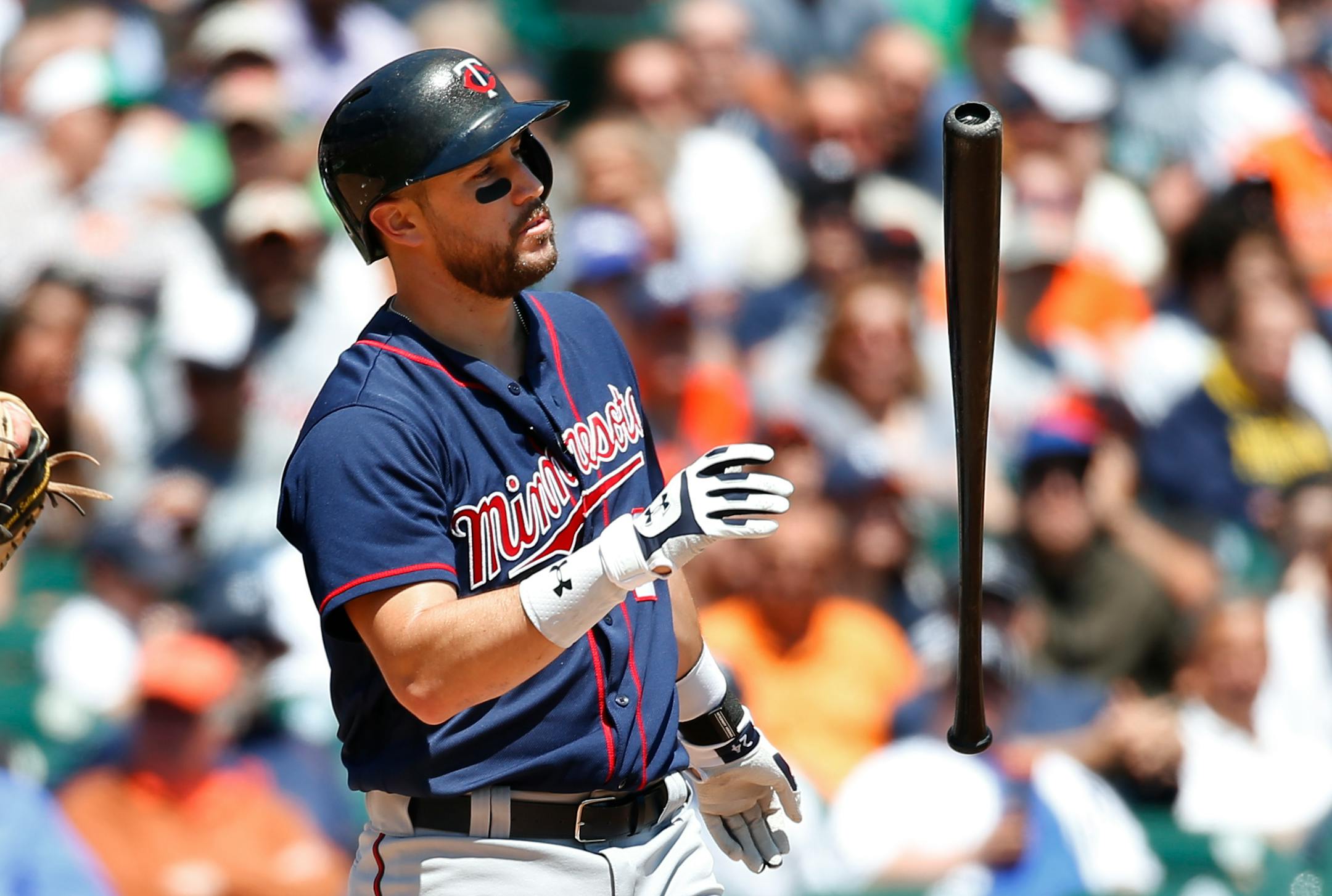 Minnesota Twins' Trevor Plouffe flips his bat after striking out against the Detroit Tigers in the fourth inning of a baseball game in Detroit, Wednesday, May 18, 2016. (AP Photo/Paul Sancya)