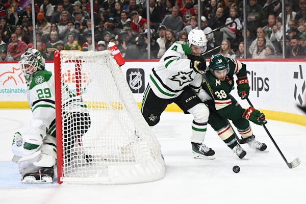 Wild forward Ryan Hartman was defended by Dallas’ Miro Heiskanen during the Stars’ 4-1 victory Thursday at Xcel Energy Center. The Wild play Tampa