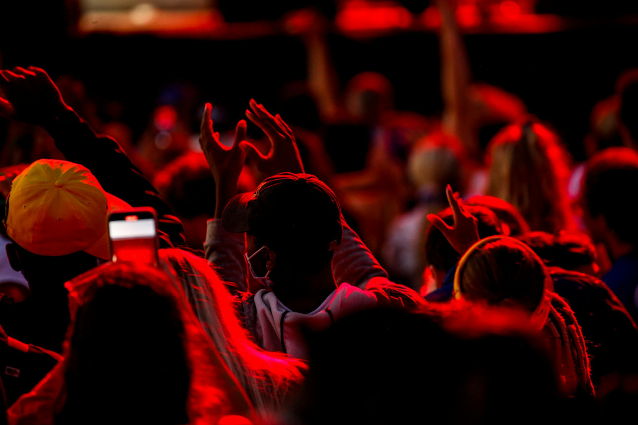 Audience members wave their hands in the air while Shaggy performs at the Minnesota State Fair Sunday, August 29, 2021.