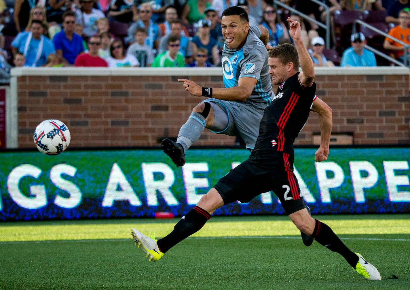 Minnesota United&#x2019;s Christian Ramirez (left) scores a goal while D.C. United&#x2019;s Taylor Kemp attempts to block during the first half on Saturday, July 29, 2017, at TCF Bank Stadium. ] COURTNEY PEDROZA &#x2022; courtney.pedroza@startribune.com; July 29, 2017; Minnesota United vs. D.C. United; TCF Bank Stadium; Minneapolis, MN.