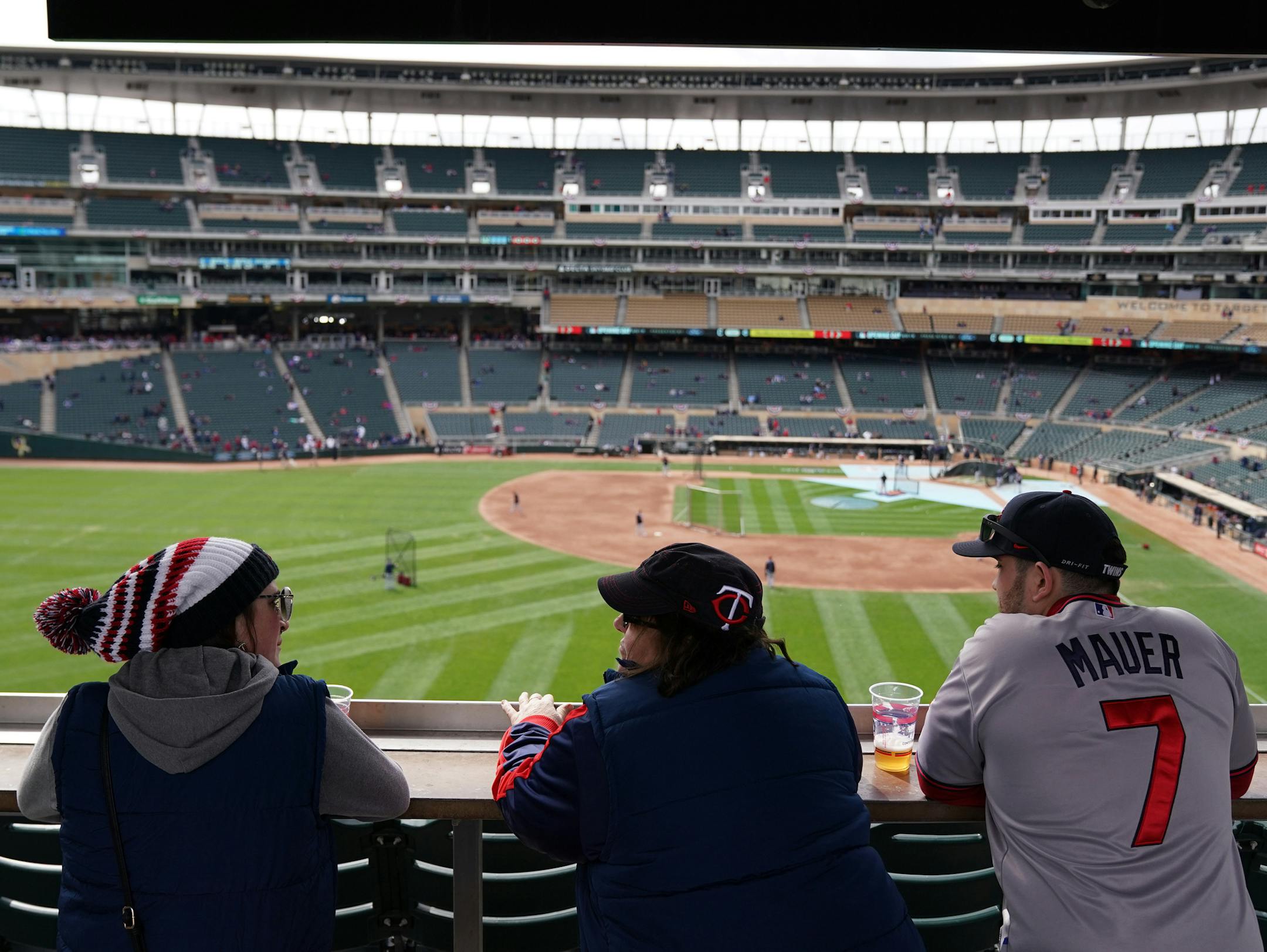 Minnesota Twins fans, from left, Paige Cook, her mom Wendy, and brother Austin of Minneapolis who've been coming to opening day for the past four years watched as Cleveland Indians players warmed up at Target Field Thursday. ] ANTHONY SOUFFLE &#x2022; anthony.souffle@startribune.com The Minnesota Twins played the Cleveland Indians on Opening Day Thursday, March 28, 2019 at Target Field in Minneapolis.