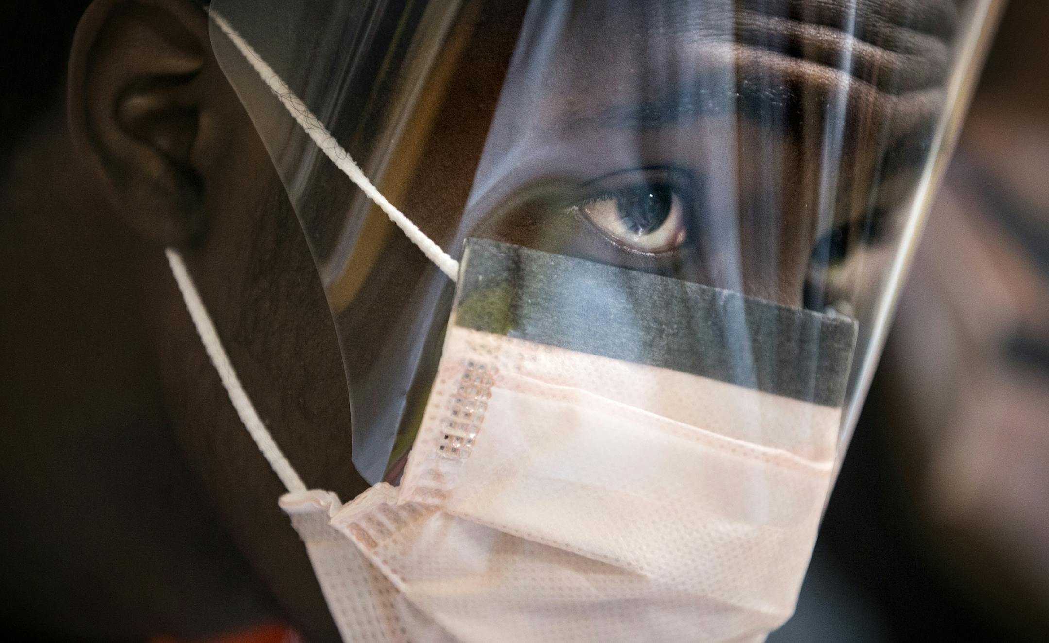 Pervious Andrews, 17, watches as an instructor shows his group how to intubate using a dissected pig during the EMS Pathways class, an emergency medical responders course for juniors and seniors at North High School in Minneapolis on Thursday, February 11, 2016. ] (Leila Navidi/Star Tribune) leila.navidi@startribune.com BACKGROUND INFORMATION: The Minneapolis Fire Department has expanded a program it sees as a key tool in recruiting people of color: an EMT training class for high school students