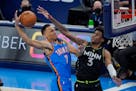Oklahoma City forward Darius Bazley (7) is defended by Timberwolves forward Jaden McDaniels (3) in the first half of the Wolves’ win Friday. (AP Pho