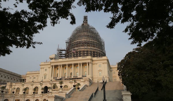 The west front of the U.S. Capitol is seen under repair Sept. 2, 2015 in Washington.