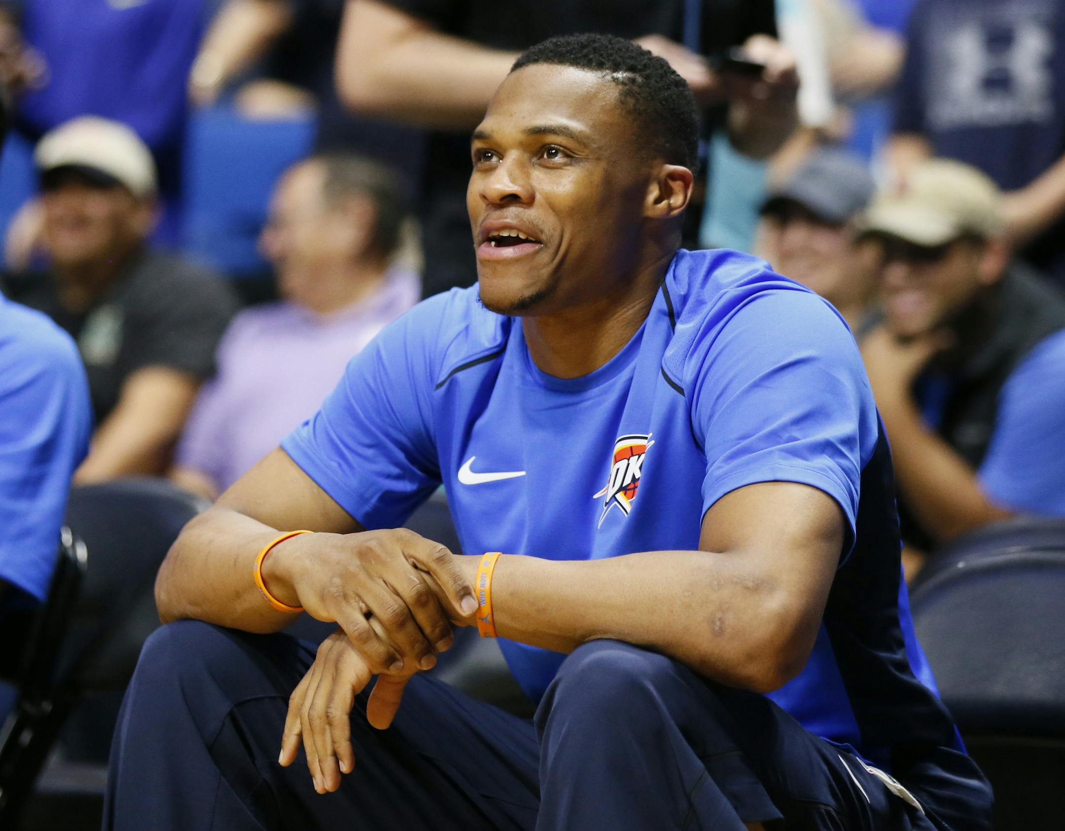 Oklahoma City Thunder guard Russell Westbrook smiles on the bench during pre-game of an NBA pre-season basketball game between the Houston Rockets and the Oklahoma City Thunder in Tulsa, Okla., Tuesday, Oct. 3, 2017. (AP Photo/Sue Ogrocki)