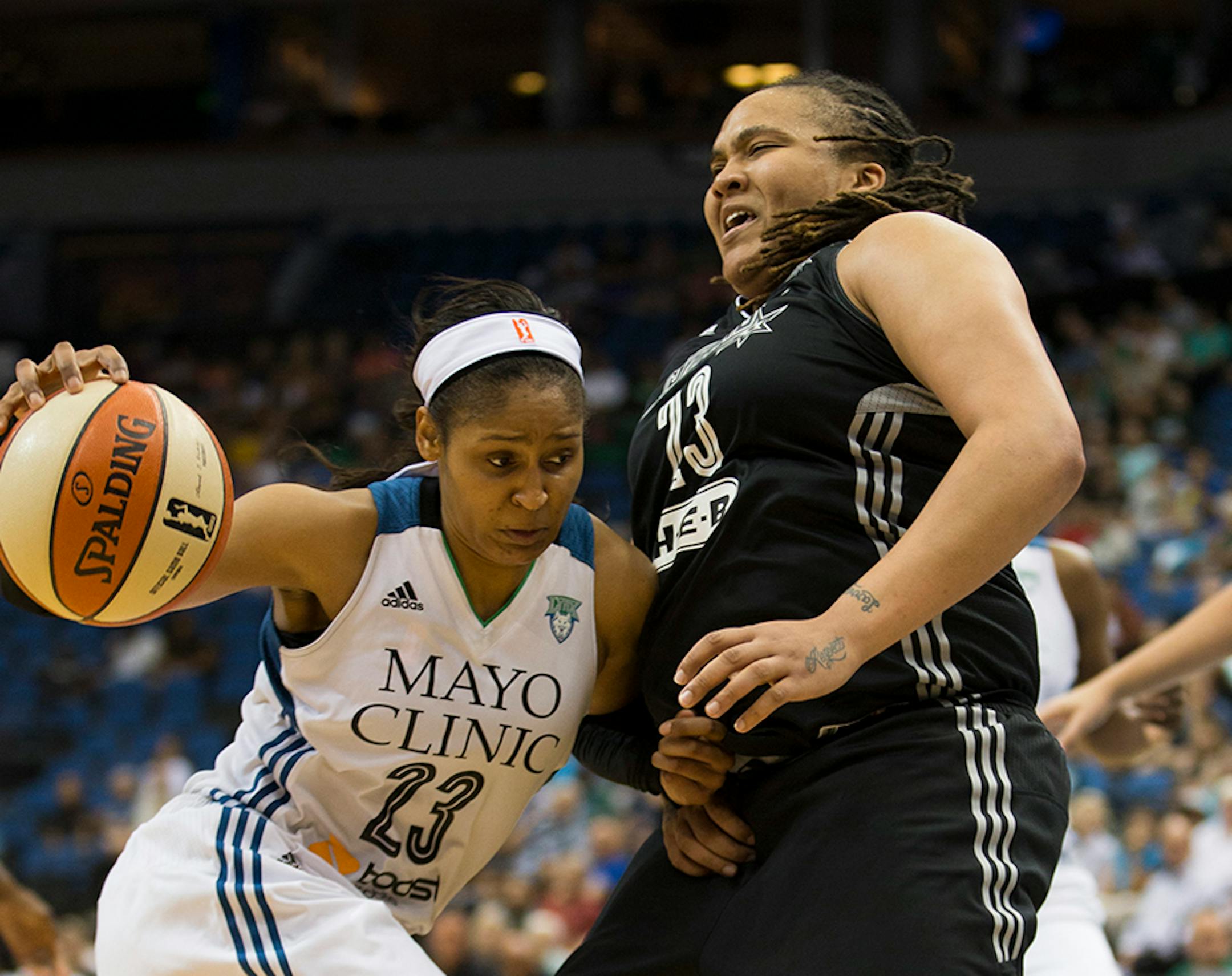 Lynx forward Maya Moore drove past San Antonio's Danielle Adams.