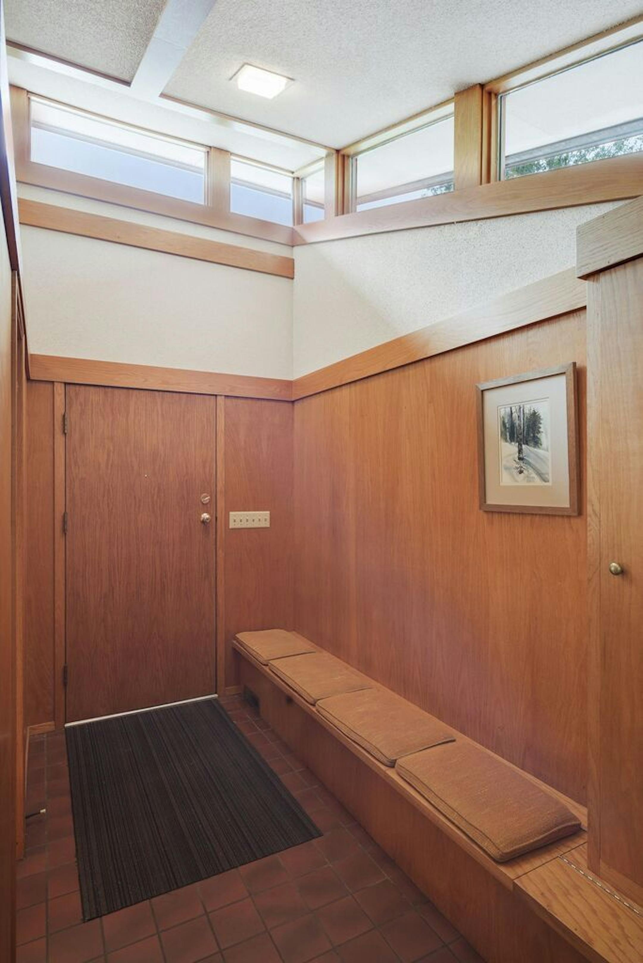There's a built-in bench in the front entry.