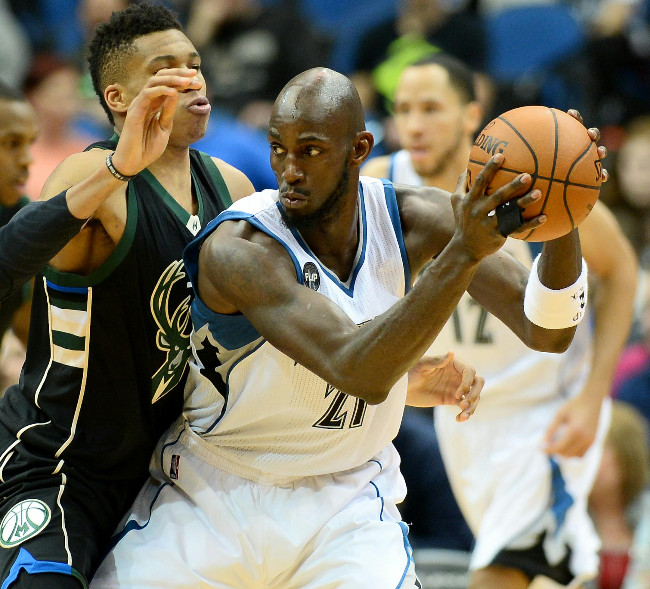Minnesota Timberwolves forward Kevin Garnett (21) was guarded by Milwaukee Bucks forward Giannis Antetokounmpo (34) in the third quarter Saturday night.