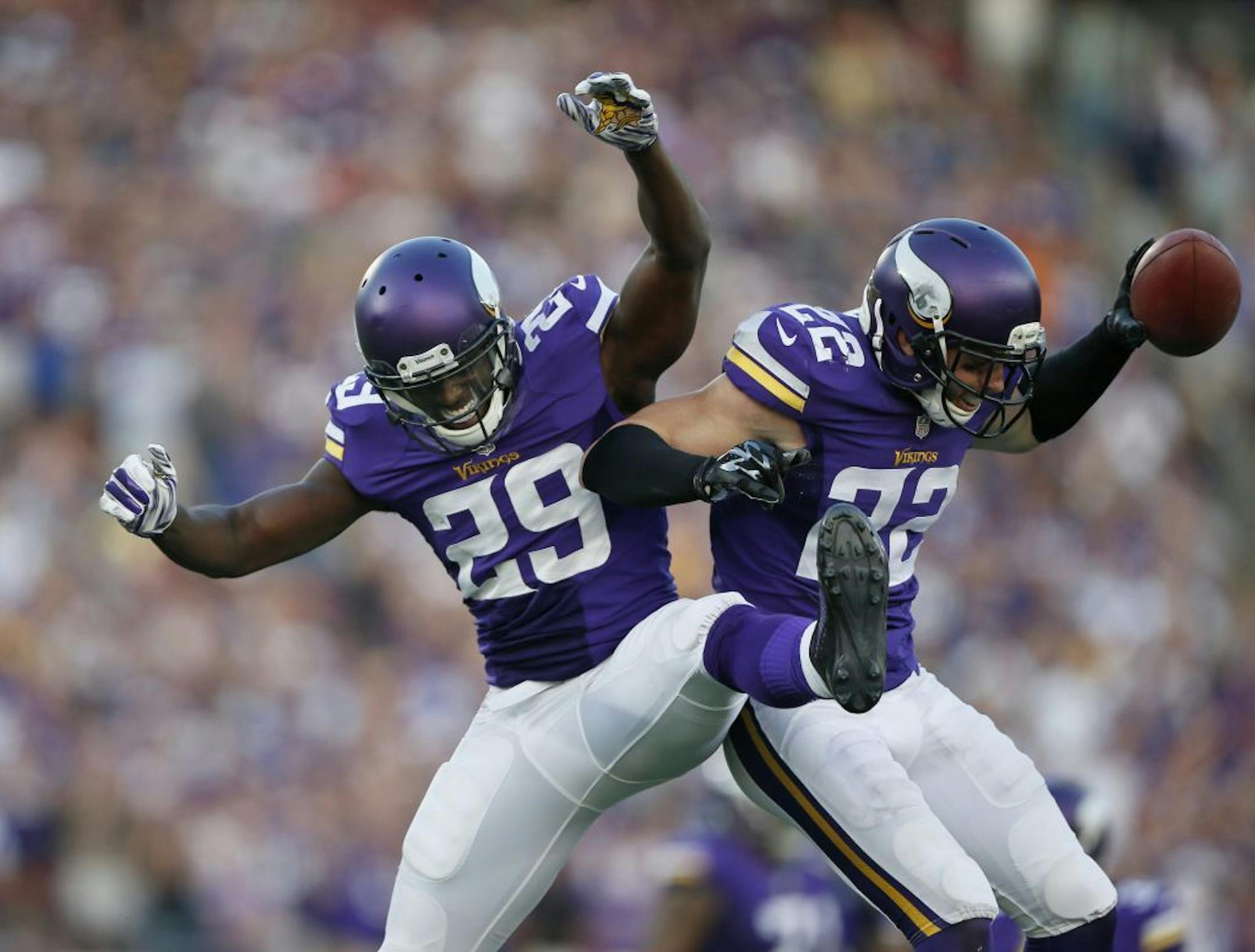 Minnesota Vikings cornerback Xavier Rhodes (29) left celebrated safety Harrison Smith (22) forth quarter interception .The Minnesota Vikings played the Atlanta Falcons at TCF Bank Stadium Sunday September 28 , 2014 in Minneapolis ,MN.