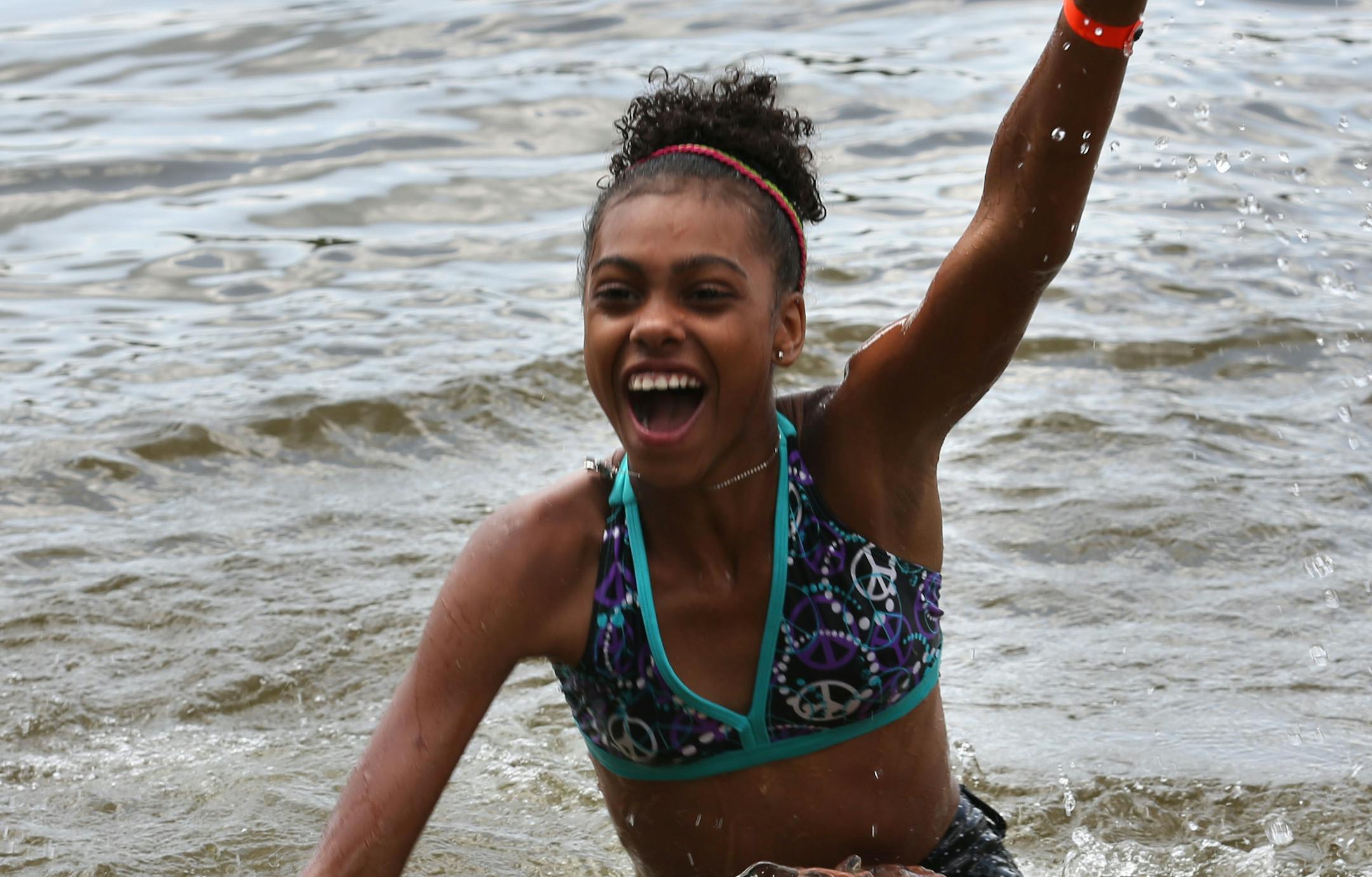 Miriana Michaels, 13, found the spoon hidden in the water as she and her camp mates played a game called "Spoon" during their rotation ] (KYNDELL HARKNESS/STAR TRIBUNE) kyndell.harkness@startribune.com The Boys and Girls Club summer camp in Mound, aka Camp Voyageur in Mound, Min. Wednesday, July 17, 2014.