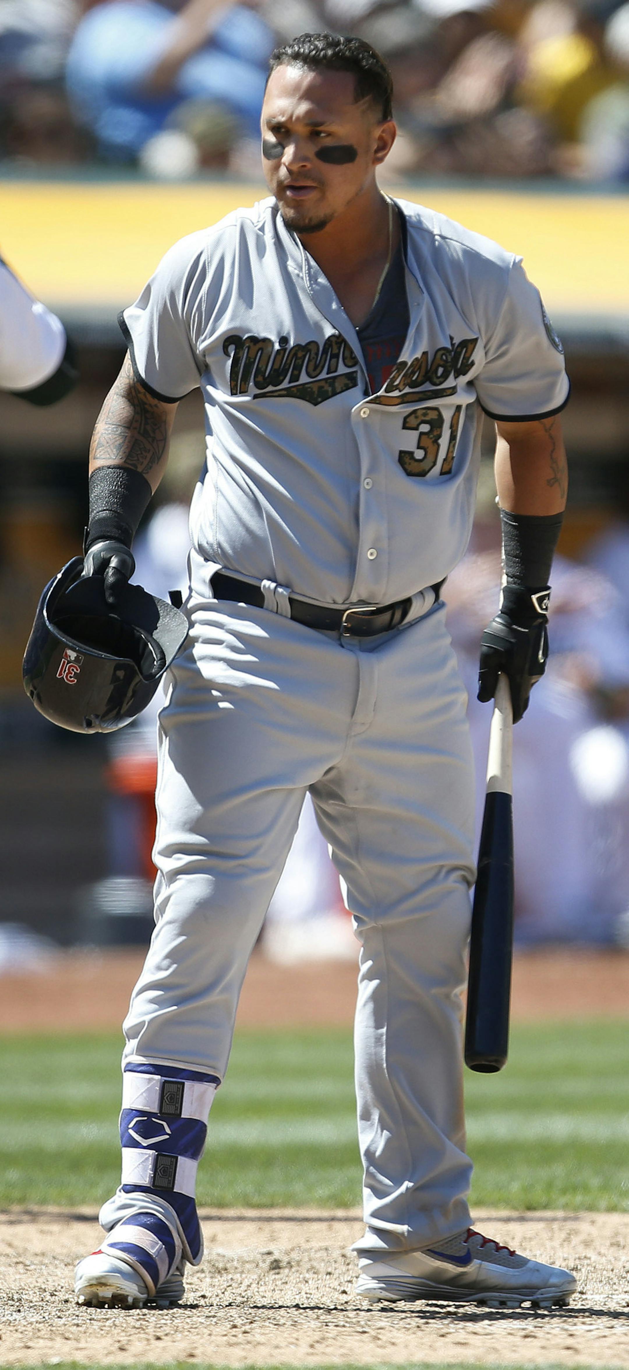 Minnesota Twins' Oswaldo Arcia reacts after striking out against the Oakland Athletics in the eighth inning of a baseball game Monday, May 30, 2016, in Oakland, Calif. Oakland won 3-2. (AP Photo/Tony Avelar)