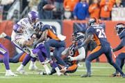 Quarterback Joshua Dobbs fumbled and took a questionable hit from Broncos safety Kareem Jackson on the Vikings’ first possession in Denver Sunday ni